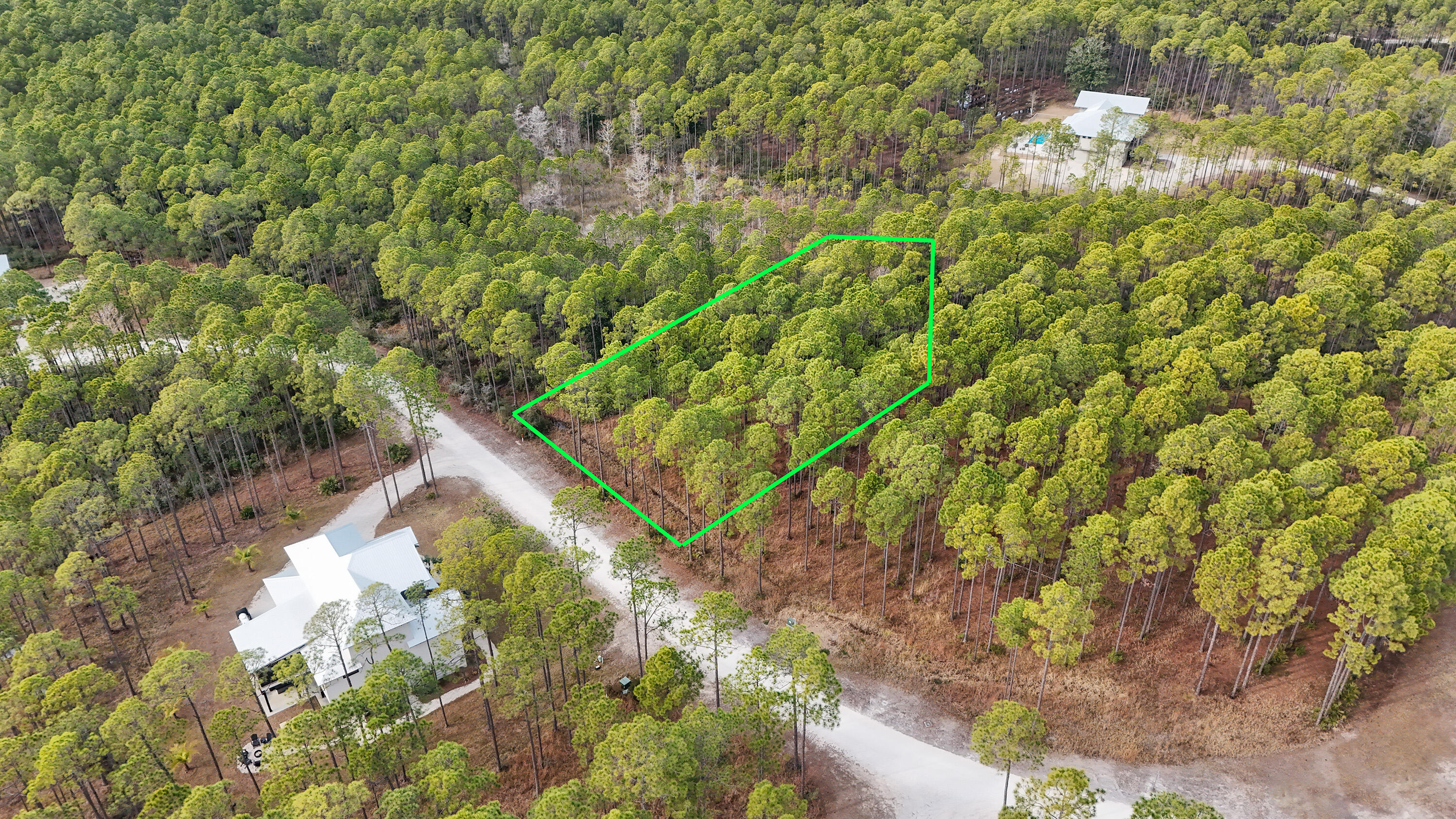 Seller financing will be considered with a substantial down payment, offering a flexible path to ownership in the unique, nature-focused community of RiverCamps. This homesite offers unmatched privacy, with protected wetlands ensuring that no homes can be built to the north or west, preserving the peaceful, secluded feel of the lot. Nestled between the Intracoastal Waterway, Crooked Creek, and West Bay, RiverCamps features just 450 homesites spread across 500 acres, with an additional 1,000 acres permanently protected as conservation land. Residents enjoy access to seven miles of scenic trails, a community boat ramp, day-use slips, and dry boat storage. Unlimited use of kayaks, canoes, paddle boards, and bicycles encourages an active, outdoor lifestyle. Exciting new amenities are coming soon, including a brand-new pool, pool pavilion, fitness center, and RiverHouse. Don't miss this incredible opportunity to build your dream home in one of the area's most breathtaking waterfront communities.