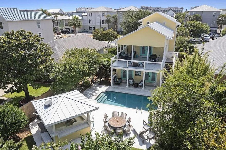 DREAMS ARE MADE OF THIS! ''Good Day Sunshine'', is situated half a block from the sugar white sands and emerald waters of Crystal Beach, this elegant coastal five bedroom, three and a half bath residence is tastefully updated, landscaped, and poised to become a new primary or secondary home, with exceptional rental income.  The first-floor features low maintenance travertine floors with four bedrooms and two shared baths, with two bedrooms opening onto the pool area and a one car garage. On the second floor is an oversized living room with hand-milled walnut flooring, vaulted ceilings that open into an impressive chef's kitchen. The commercial-grade luxury kitchen with custom cabinetry has durable granite countertops, two Sub-Zero refrigerators, a large Wolf gas range and a wine fridge.