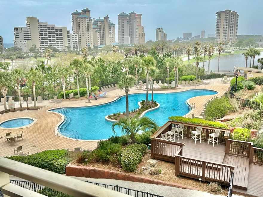 Perfect Location and well maintained!  This 3rd floor corner unit offers the biggest wrap around balcony with views over the pool and you can see the gulf. New paint throughout, floors, and furniture are just a few of the recent updates.  The lockout floor plan allows versatility if you choose to rent.  It can be rented as a 2 bedroom condo, a 1 bedroom unit with a full kitchen & bathroom, or as a studio.  Don't miss seeing this condo with the huge corner balcony and the fabulous views.  Lots of new cool colors and coastal artwork make this a great beach getaway plus a great rental property!