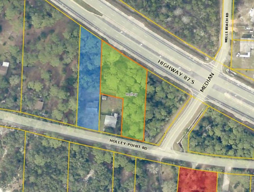 Wooded lot located on Holley Point Road that backs up to Hwy 87. Zoned R2 SFR. Lot has partial water view.