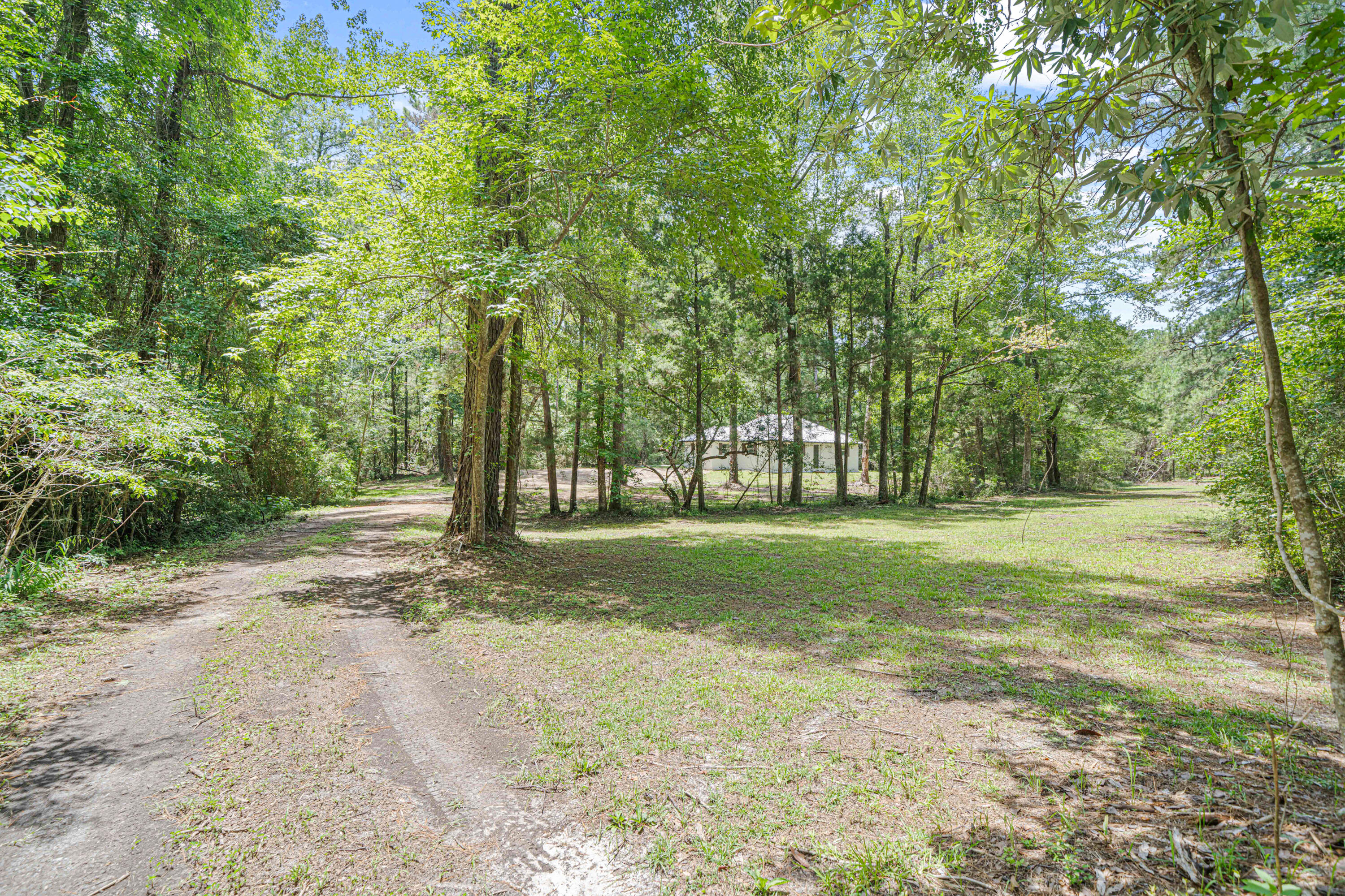 🏡New driveways being added to easement and driveways. 25k expense. 606 Rushing Road, Ponce De Leon, FL 32455 -- New driveways being added to easement and driveways. 25k expense..Rare Find: 100% Updated Block Home on 2.5 Private AcresEscape to peace, privacy, and modern style in this move-in-ready 2-bed, 1-bath retreat. Tucked deep in nature yet completely upgraded for today's lifestyle.🔹 Key Features:- New septic, new well, new AC- 2012 metal roof, solid concrete block construction- Stylish kitchen with modern appliances & sleek countertops- Renovated bathroom with updated fixtures & finishes- Fresh flooring, lighting, paint, and details throughout- Bright open layout with clean lines and great natural light- 2.5-acre wooded lot--