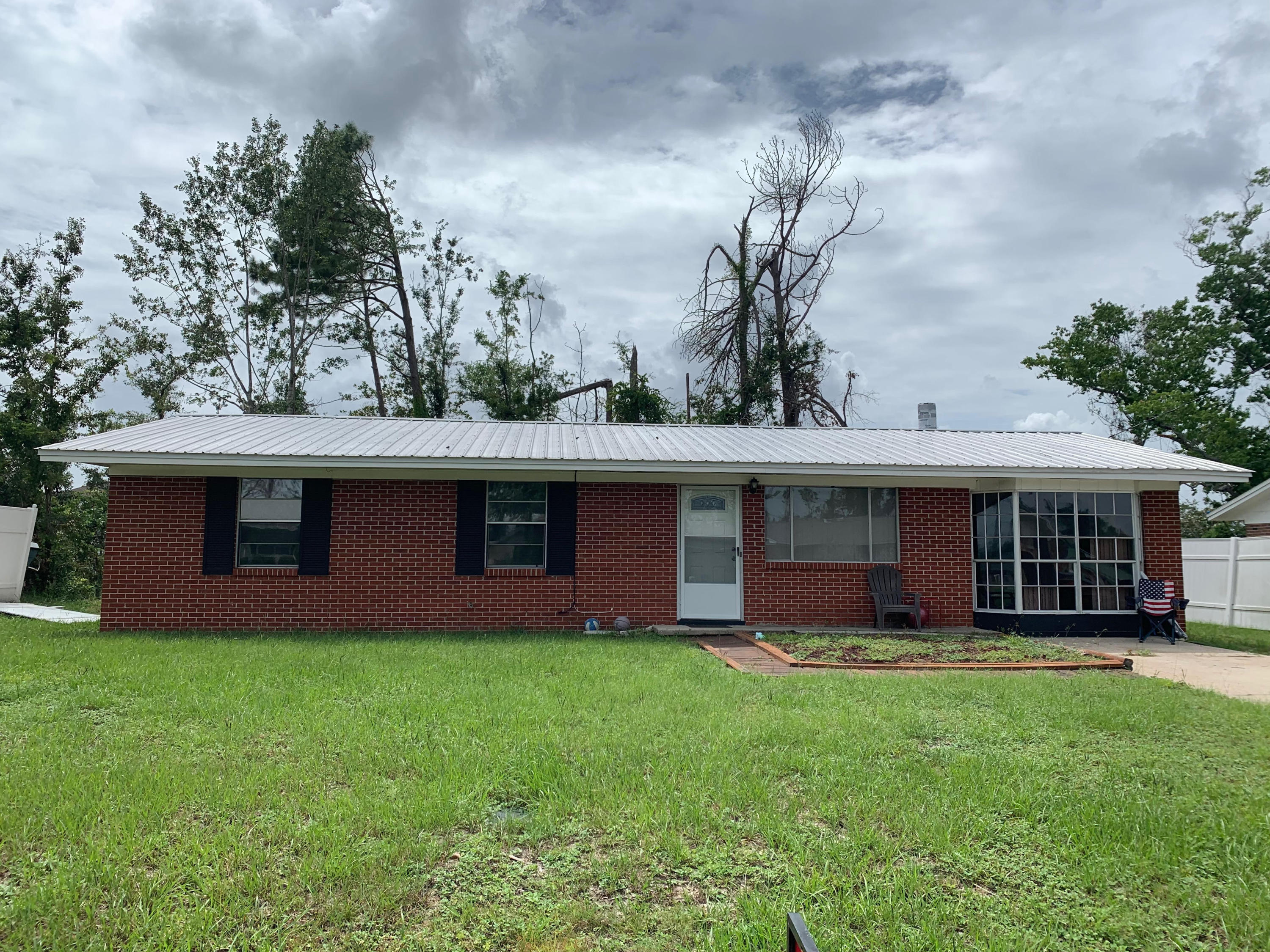 Affordable home in Lynn Haven! HVAC replaced in 2017, hot water heater 2016, updated metal roof. All tile in living and bedrooms and vinyl in the baths. There's a den area with a fireplace. This home is energy-efficient with updated appliances and lots of extra blown in insulation. Wired for a whole house generator. Windows are tinted with UV block which keeps the electric bill down and helps prevent hurricane damage. There's a 12 x 24 covered patio in the fenced backyard As well as a small detached storage building.