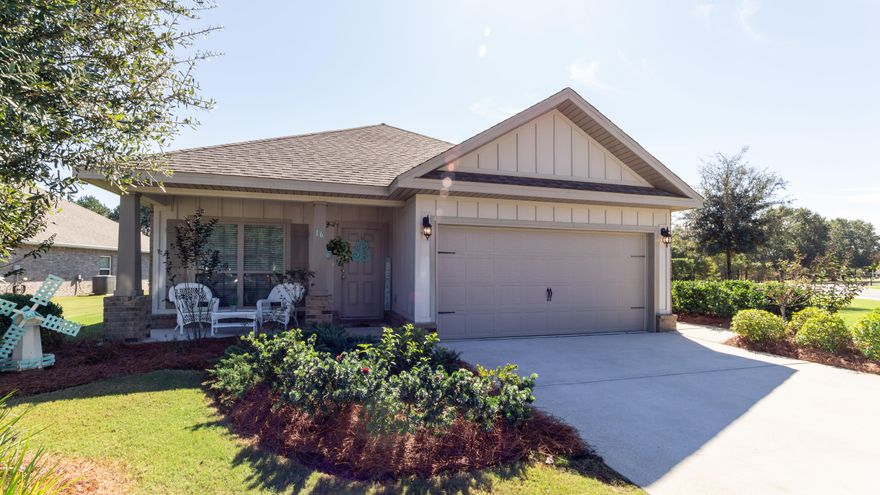 Must see this beauty located in Passages of Hammock Bay. This home has a sought after open floor plan, covered front porch, screened-in back porch and  premium water front lot. Features include: wood look tile, separate office with French doors, granite counter tops in kitchen & baths, granite island has overhang for bar stools, stainless steel appliances, gas stove & fireplace, kitchen back splash, tiled master shower w/shower door, soaking tub, trey ceiling in master, blinds throughout, side entry/exit door in garage, new well pump and a large waterfront lot on a cut-de-sac street. Hammock Bay's amenities include: 3 pools, new large gym with lots of equipment, tennis & pickle ball courts, dog park, clubhouse, theatre room, putting green, dock at the bay, walking/biking trails and more!