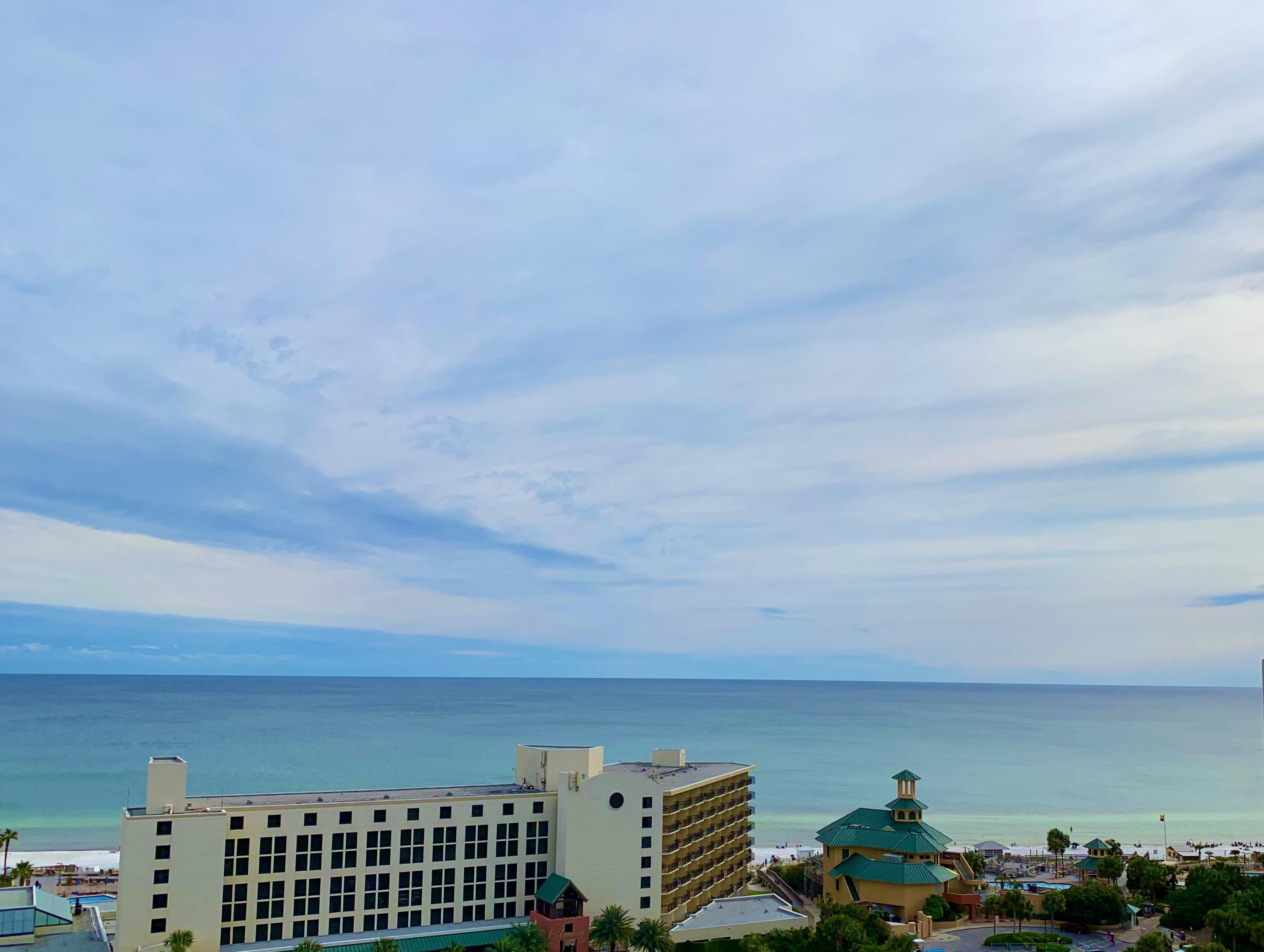 This spacious condo offers amazing, panoramic views of the Gulf from the 11th floor.  Located next to the Sunset Deck, step out your door into the hall and onto the Sunset Deck for extra-long mornings soaking up calm, gulf breezes. Enjoy other Luau amenities: lagoon-style pool with swim-under waterfall, the gas grills with tables under the pergola, the fitness center, and the short walk to the beach.  Did I mention the views?  The views are the best gulf views at Luau! Selling furnished, with some personal exclusions. It's a perfect second home, or a vacation rental property. Garage parking is un-assigned.