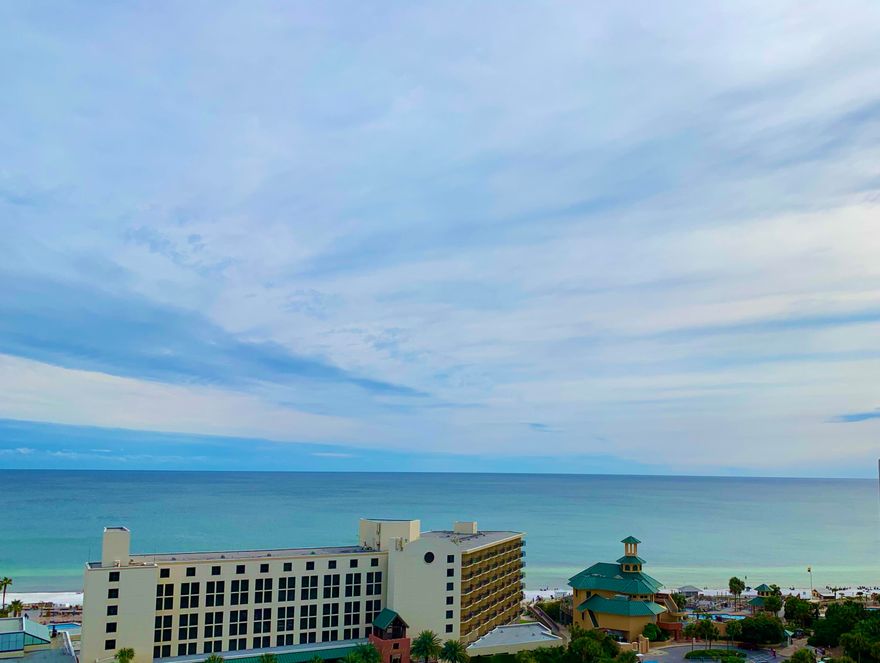 This spacious condo offers amazing, panoramic views of the Gulf from the 11th floor.  Located next to the Sunset Deck, step out your door into the hall and onto the Sunset Deck for extra-long mornings soaking up calm, gulf breezes. Enjoy other Luau amenities: lagoon-style pool with swim-under waterfall, the gas grills with tables under the pergola, the fitness center, and the short walk to the beach.  Did I mention the views?  The views are the best gulf views at Luau! Selling furnished, with some personal exclusions. It's a perfect second home, or a vacation rental property. Garage parking is un-assigned.
