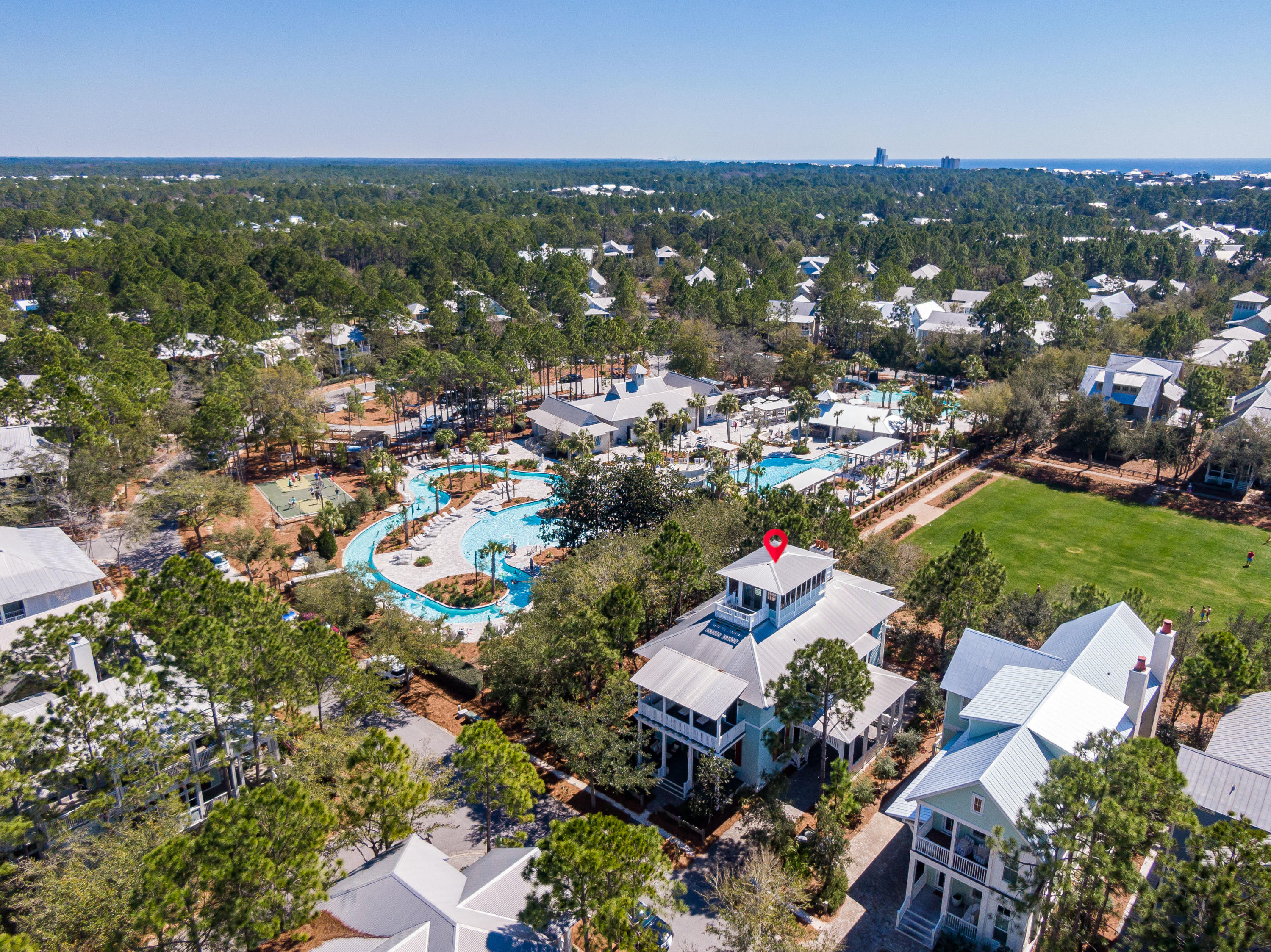 This breathtaking WaterColor home boasts truly amazing design details with consideration to the beautiful parks surrounding Camp WaterColor. The home was designed by Dungan Nequette and built by Chris Clark with families in mind and incredible attention to detail. All three stories of this home offer the privileged views of Wood Fern Park and the newly remodeled resort style Camp WaterColor pools and amenities. The first floor of the home includes the kitchen, dining area which spills into a spacious screen porch, a great room with high ceilings and a towering stone fireplace. Step out to enjoy outdoor living on the back porch complete with an extended patio overlooking the park activities, a grilling area and more.