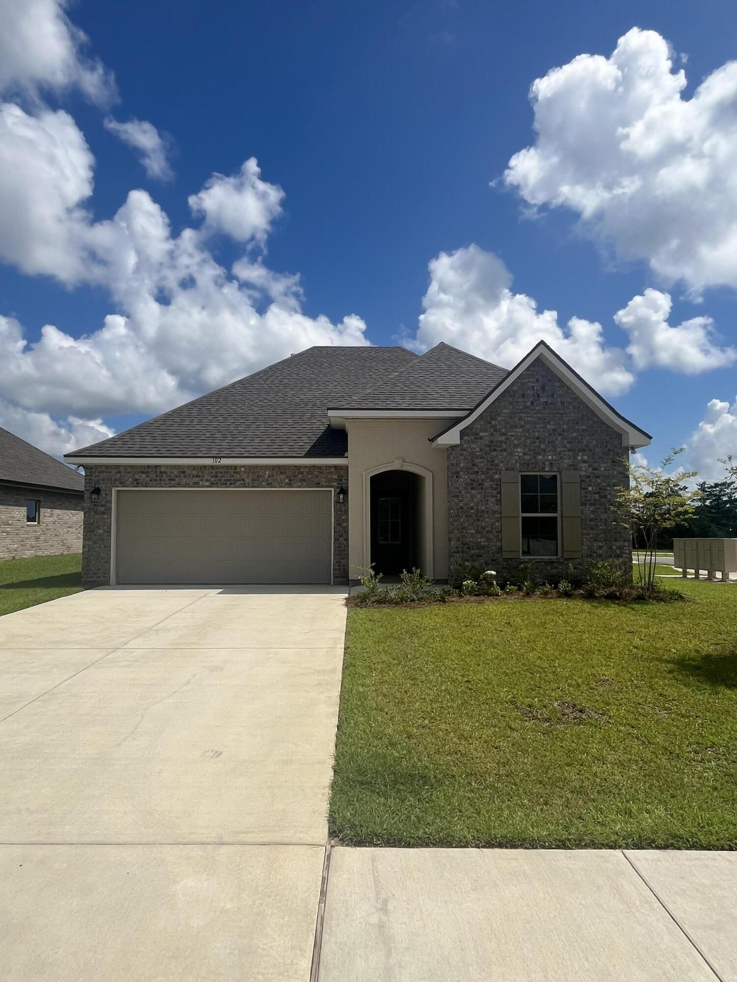 Awesome builder rate plus FREE refrigerator. Restrictions apply.Located on a corner lot, the TRILLIUM IV A in The Bluffs at Lafayette community offers a 3 bedroom, 2 full bathroom open and split design. Upgrades added (list attached).Special Features: double vanity, garden tub, separate shower, and walk-in closet in master bath, kitchen island, walk-in pantry, boot bench in mudroom, covered porches, crown molding, ceiling fans in living and master, smoke and carbon monoxide detectors, landscaping, architectural 30-year shingles, flood lights, and more!Energy Efficient Features: tankless gas water heater, kitchen appliance package with gas range, vinyl low E windows, and more! Energy Star Partner.