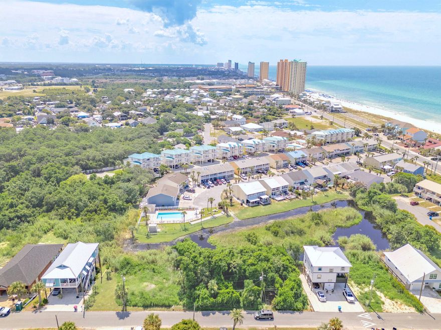 BUILDABLE LAND OPPORTUNITY! Discover your dream coastal retreat on the picturesque West end of the Panama City Beach with this exceptional pond-front buildable lot. At an excellent price and with easy access to Laguna Dedicated Beach, this beautiful 60'x67' waterfront lot is zoned R2 to accommodate a single-family detached home. Additional lot available. Call for details! Imagine waking up to serene water views, stunning sunsets, and the soothing sounds of nature. No flood insurance is required, and water and sewer lines are available for your convenience. Quick access to Laguna Beach means beach time is a must! Opportunities like this are rare and won't last long. Act now to enjoy your slice of paradise! Contact us today and we'll help make your dreams a reality!