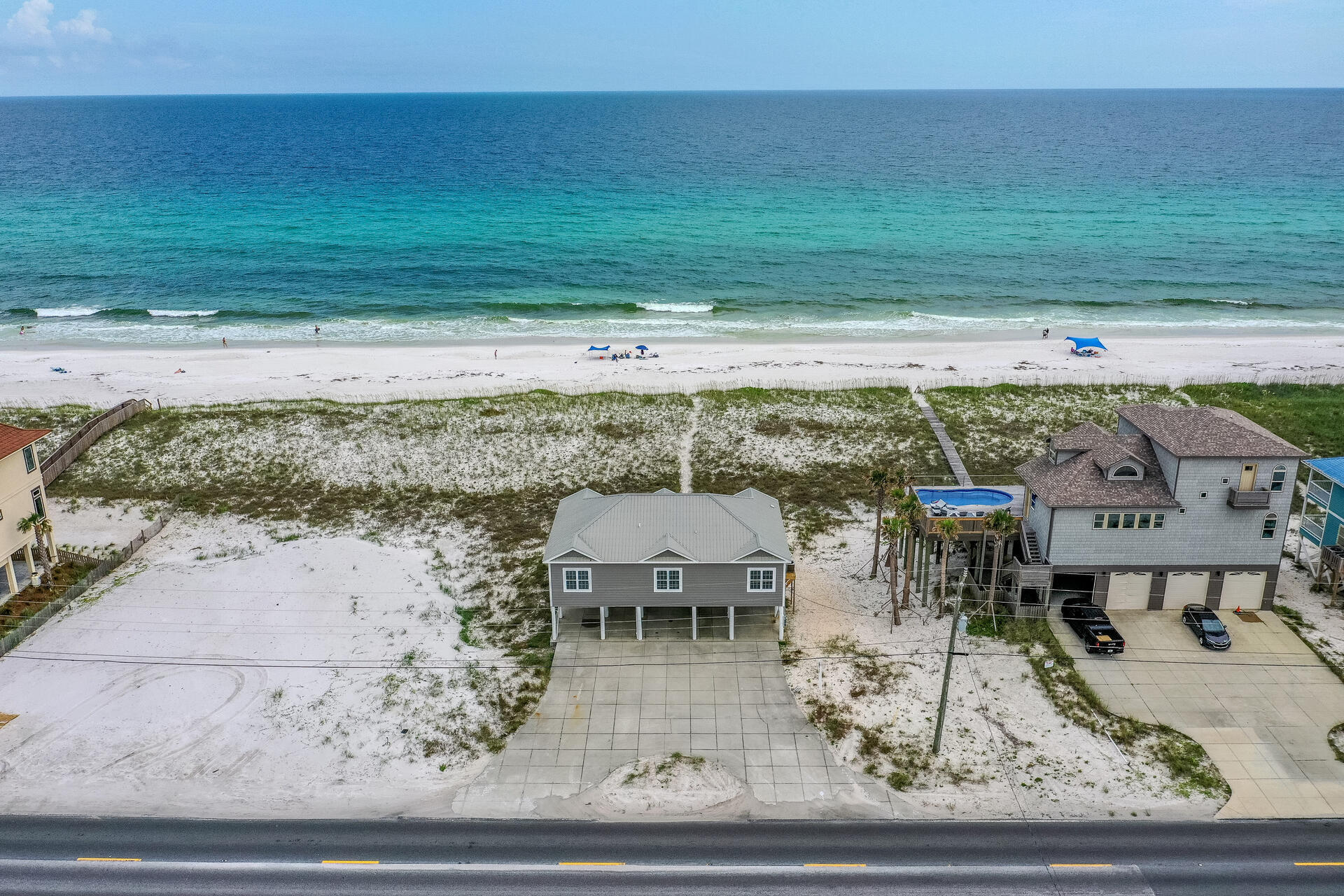 Welcome to your person Beach House! This home boasts 100' of the world's most beautiful beaches just at the tip of your fingers! Nestled in Navarre Beach where you can enjoy sea shelling at the National Seashore, local area dining and live music, surrounding area attractions, Intercoastal Waterway beaches, watersport rentals; or, make yourself right at home and enjoy the Gulf of Mexico; fish from the beach in your own backyard or make sandcastles with your family. From your deck, you can enjoy cookouts with friends and family while aweing at the panoramic views of the Gulf of Mexico. This home is located within a quick drive to local grocery stores, restaurants, and gas stations, while being a short drive to Destin and Pensacola Beach. The Beach House has an open floor concept with the