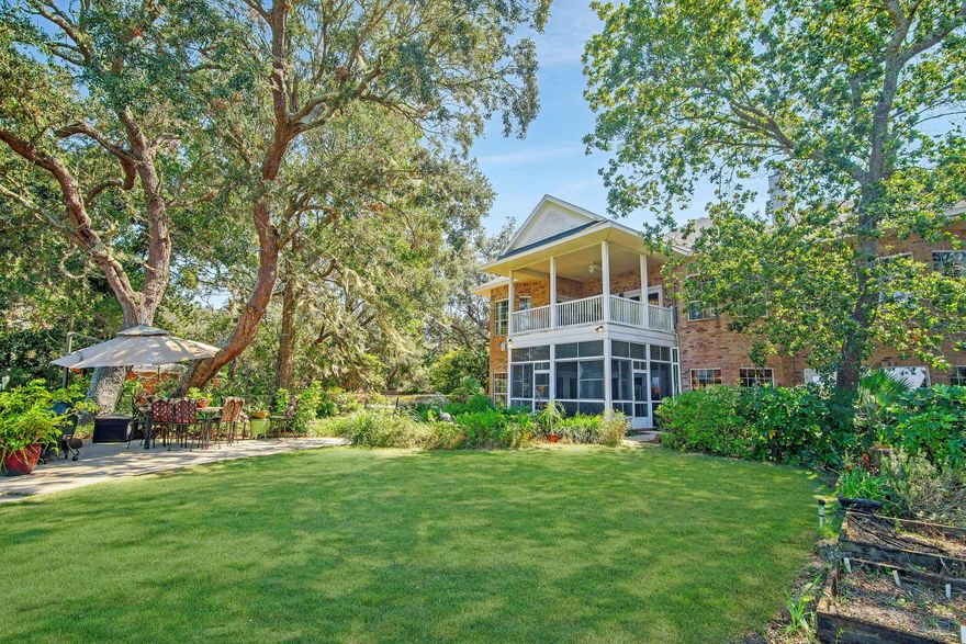 This wonderful Bay front home is situated on over half an acre. Upon arrival, you'll note the gorgeous Oak trees and mature Magnolia tree with ample parking. There is plenty of room for boat and RV parking with a side drive next to the storage shed that would fit an RV perfectly under shady Oaks. This home has an open floor plan with a large living area featuring custom built-in book shelves. The kitchen is a Chef's kitchen and comes fully equipped with a separate cooking station with a gas stove top and 2 additional skillets surrounded by seating. Truly perfect for entertaining Chef!. You'll also enjoy the beautiful wood cabinetry, leather finish granite countertops, breakfast bar, stainless steel appliances, double wall oven, built-in microwave and wine fridge. There are 3 French doors t