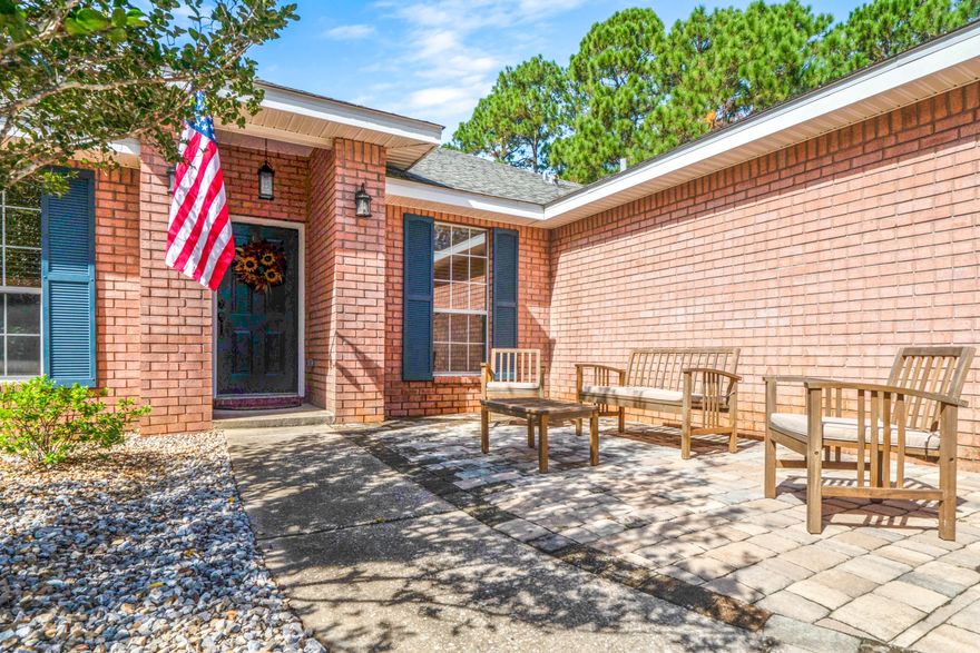 This all brick home provides privacy on OVER a half acre lot. .64 acres of beautiful landscape, natural surroundings, and newer upgrades within the home.The new hard flooring was recently installed, and the pavers are a nice feature in the front entrance of the home. Security cameras/system are negotiable, and the appliances all convey with the home purchase. There is a 4th room that can be used as an office, den or sitting room before entering the large open floor plan. The split design has two more rooms separate than the master retreat. They also upgraded the designer shades on the windows for less, or more natural lighting. This darling home is a must see! Great East location of HBTS to have a short commute to Hurlburt Field also.