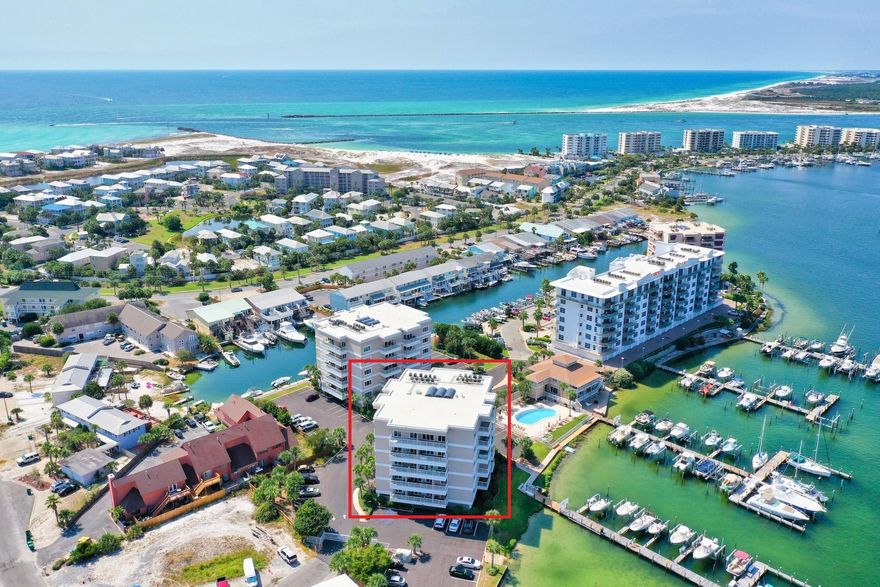 This fully furnished, harbor front condo is a must see! Sun King Towers is located on Holiday Isle, in a quiet and secluded setting on the harbor. Come home to gorgeous views of the harbor and canal, just moments from the white sand beaches. Interior updates include a beautiful, newly renovated kitchen with thick granite countertops, mosaic backsplash, an island which doubles as a breakfast bar with gorgeous details, ample cabinets, custom lighting and stainless steel appliances. Tile floors throughout the entire unit for easy beach living! The spacious master bedroom is beautifully furnished and has direct access to a private balcony with gorgeous views of the Destin Harbor. Watch as boats pass by on the emerald green and crystal blues waters of the Gulf of Mexico. Golf cart included!