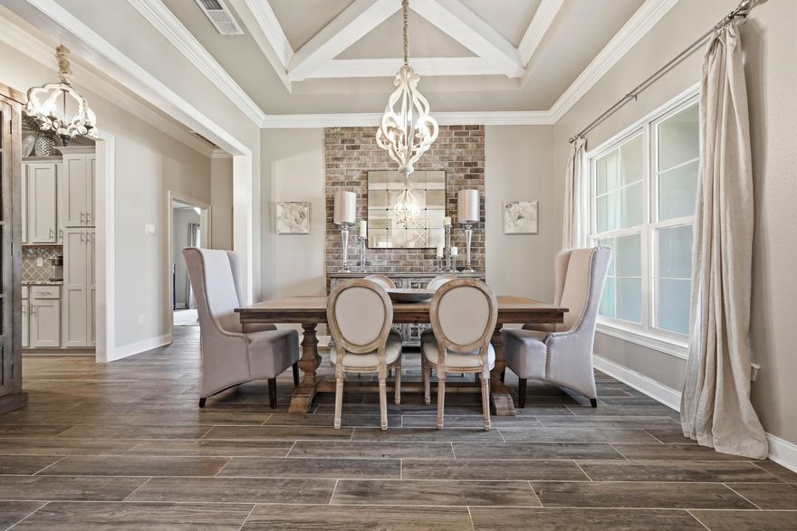 BEAUTIFUL, well-maintained home! This 4BR/3BA residence offers over 3,010 sq ft of thoughtfully designed living space, built in 2019 and ideally located just MINUTES from NAVY FEDERAL and the Shopping, dining, and medical conveniences of 9 Mile Rd. $10,000 allowance offered for buyer (closing costs, rate buy-down)! The Exterior showcases a timeless Brick & Stucco finish, seamless gutters, and a $10K professional landscaping package for standout curb appeal. Inside, you'll find an open-concept layout with a FORMAL dining room and dedicated office, enhanced by COFFERED ceilings, crown molding, tray ceilings, Custom Lighting, FEATURE walls, and recessed lighting--creating a warm yet elevated feel throughout. The kitchen is a true centerpiece, featuring a LARGE granite island with bar seating, stainless steel appliances, tile backsplash, soft-close cabinetry, and a 5-burner gas range. The split floor plan offers privacy with three guest bedrooms and two full baths, including a convenient Jack-and-Jill layout. The SPACIOUS primary suite includes a sitting area, walk-in closet with direct laundry access, and a spa-like bath with double vanities, soaking tub, and tiled WALK-IN Shower. Enjoy year-round relaxation in the screened-in SUNROOM with ceiling fans and full electrical--perfect for entertaining or unwinding. Additional highlights include CUSTOM LIGHTING, heated and cooled oversized 2-car garage with a painted floor.