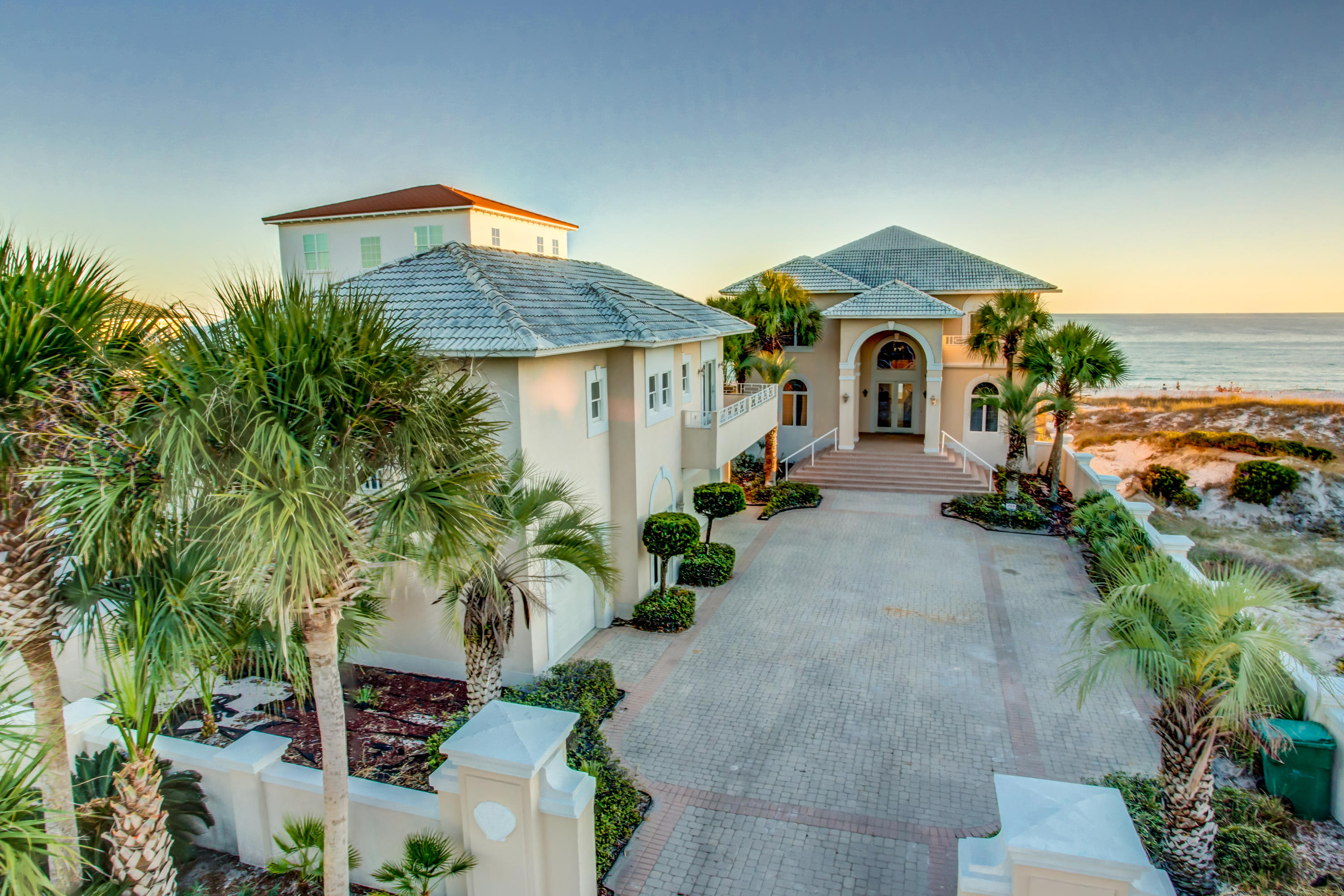 PRICE JUST REDUCED FOR RAPID SALE!! Savor the seaside with 67' directly on one of the most beautiful beaches in America! This beautiful home in a fabulous Crystal Beach neighborhood enjoys incredible views, expansive decks, and your own pool overlooking the Gulf of Mexico! The first floor of the main house features a large, open kitchen, dining, and living area, which is ideal for entertaining, plus 2 bedroom suites. The entire second floor is a luxurious master suite with bedroom on the water, palatial bath, huge closet, living area with wetbar, loft/office area, and large deck. It is easily reached by the attractive curving staircase or via elevator!
