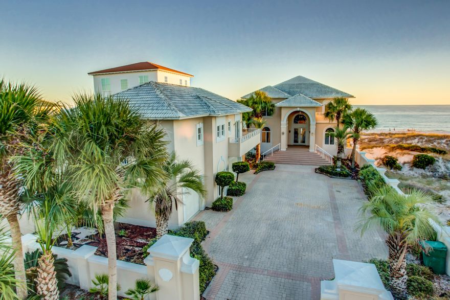 PRICE JUST REDUCED FOR RAPID SALE!! Savor the seaside with 67' directly on one of the most beautiful beaches in America! This beautiful home in a fabulous Crystal Beach neighborhood enjoys incredible views, expansive decks, and your own pool overlooking the Gulf of Mexico! The first floor of the main house features a large, open kitchen, dining, and living area, which is ideal for entertaining, plus 2 bedroom suites. The entire second floor is a luxurious master suite with bedroom on the water, palatial bath, huge closet, living area with wetbar, loft/office area, and large deck. It is easily reached by the attractive curving staircase or via elevator!