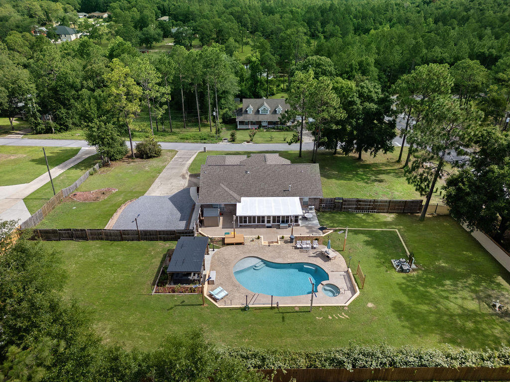 Your North Crestview Oasis Awaits! Discover this beautifully upgraded 3-bedroom, 2-bathroom gem nestled on a 1-acre lot in North Crestview. With 2,548 square feet of thoughtfully designed living space, this home is the perfect blend of comfort, style, and function.Step into your private paradise featuring an amazing in-ground pool complete with a brand new poolside cabana and luxurious high-end furniture--perfect for relaxing or entertaining in Florida's sunshine. The expansive, leveled parking area with a retaining wall offers ample space, including room for your RV.Enjoy ultimate privacy with a brand new privacy fence topped with a sleek privacy shade. Need space for hobbies or storage? This property delivers with 4 outdoor sheds, a dedicated workshop, and plenty of room to roam.
Inside, you'll love the newly renovated master bathroom with elegant tile finishes and a spa-like feel. The kitchen boasts a new stainless steel refrigerator (conveys with the home), and the Florida room is climate-controlled with a mini-split system, making it the perfect year-round retreat.
Additional upgrades include:
*State-of-the-art water heater
*Smart security system for peace of mind
*Numerous modern updates throughout the home
This is more than a home it's a lifestyle upgrade. With everything already done for you, all that's left is to move in and enjoy your private North Crestview retreat.
Schedule your showing today paradise is calling!