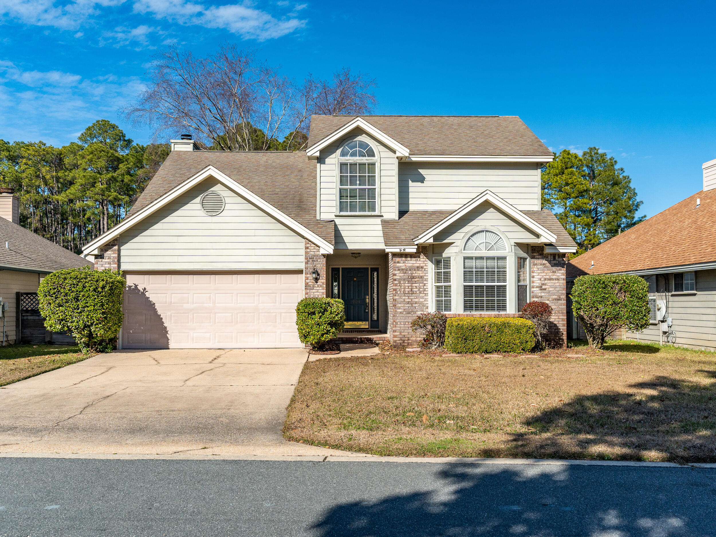 This beautiful 4-bedroom, 2.5-bathroom home located in the Crosswinds neighborhood of Fort Walton Beach, Florida, offers the perfect blend of comfort and convenience. This property is ideally located with convenient access to Eglin Air Force Base, Hurlburt Field, Fort Walton Beach Medical Center, as well as nearby shopping and dining, offering the perfect balance of peaceful living and connectivity.Upon entering, you'll be impressed by the open, airy feel of the home, with soaring cathedral ceilings and a dramatic staircase creating a grand first impression. The spacious layout is ideal for family living and entertaining, with a large eat-in kitchen that flows seamlessly into the living room and formal dining area. The kitchen is well-equipped with plenty of counter space, modern appliances, and ample storage, making it perfect for cooking and hosting.

The master suite, located on the first floor, is a private retreat. It's spacious and bright, offering a peaceful space to unwind. The attached en-suite bathroom features a double vanity, soaking tub, separate shower, and plenty of room for all your personal items.

Upstairs, you'll find three additional bedrooms, each with generous closet space and natural light. These rooms are perfect for family members, guests, or even a home office. A full bathroom conveniently serves these rooms, ensuring everyone's comfort.

Outside, you'll find a large fenced backyard, perfect for pets or outdoor activities. The open deck extends past the screened-in porch, providing plenty of space for outdoor dining or relaxing in the sun. The screened porch adds a nice touch, allowing you to enjoy the outdoors without the worry of bugs.

Additional features of the home include a two-car garage, providing secure parking and extra storage space. The split floor plan ensures privacy for the master suite while keeping the other bedrooms separate upstairs, making this home feel spacious and practical.

Located in the desirable Crosswinds neighborhood, this home is close to major military bases and local amenities, making it an ideal spot for those working nearby or wanting to enjoy all that Fort Walton Beach has to offer. 