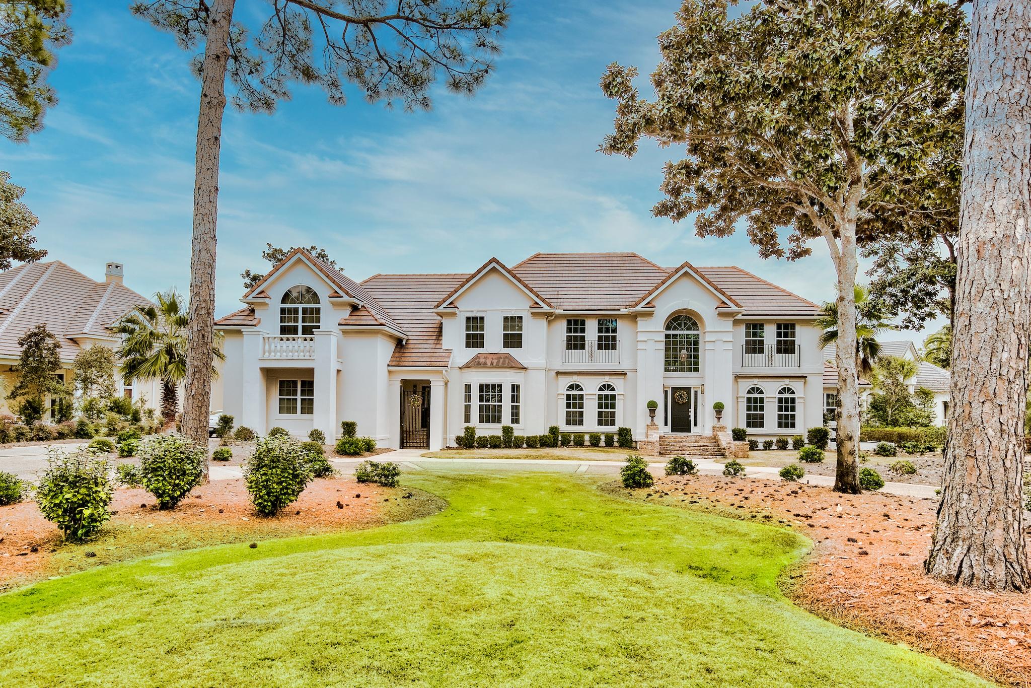 Featuring expansive views across the Burnt Pine Golf Course and the lake, this fully renovated and redesigned Burnt Pine executive home provides its owners with the utmost in comfort and design. From the moment that you walk through the front door, you immediately realize that you have entered a special home. Crisp white walls with beautiful, custom woodwork are in perfect harmony with the ebonized wood floors giving the home a contemporary flair while remaining true to the home's traditional design. This entertainer's dream home has formal living and formal dining areas that flow into an open family room with soaring 20' ceilings. As you continue to the outdoor living area, you can enjoy the new heated pool and hot tub or enjoy the peace and tranquillity of your own private dock.