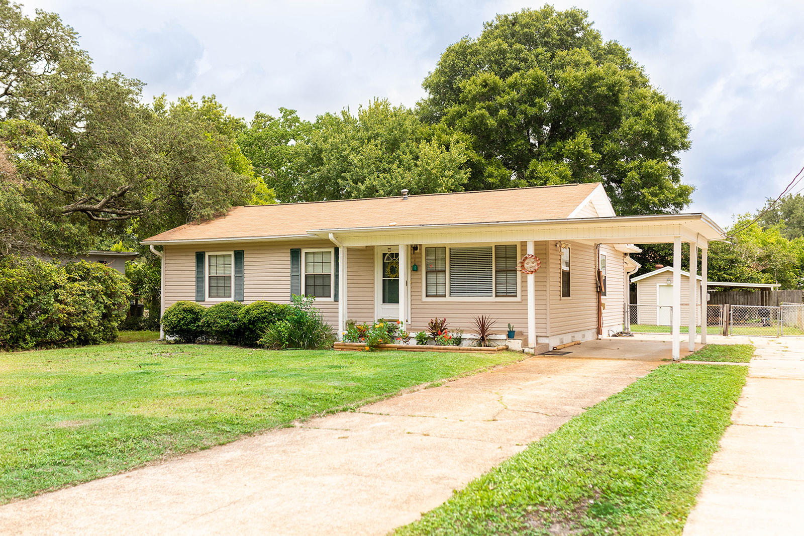 This super cute move in ready home is located in central Fort Walton Beach and is convenient to both bases, shopping and the beaches. As you enter the front door you are welcomed by an abundance of natural light and the warmth of the laminate flooring. The home has 2 living areas the first is a living room/dining room combination. The den is very spacious and has plenty of room for gatherings. The master bedroom features two closets and a huge master bathroom with dual vanities and an abundance of built in cabinets. This home has plenty of closets. The efficient kitchen has all appliances in place. The fenced in back yard has a storage shed with electricity and carport area for grilling or your hobbies. The home has two driveways with plenty of parking.