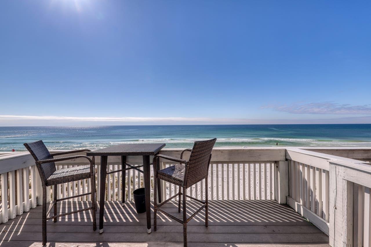 This is it!!! This beautiful townhome is the gulffront getaway that you have been dreaming of!! Bookings currently total near $75K with projected rental income for 2021 of around $90K. Best of all there are NO HOA DUES!! This lovely, turn key, fully furnished 4 BR 3.5 BA townhome sits right on the beach! Enjoy stunning views of the gulf from nearly every room and from the spacious TREX decks on the all 3 levels. The updated kitchen is bright and open. It features granite countertops, SS appliances, and is fully stocked with dishes, cooking utensils, etc. The nicely appointed living and dining room open out to the 2nd FL balcony with a grill and outdoor seating. The third floor has 2 bedrooms. One is a beachfront master suite with a covered balcony overlooking the gulf. See supplement...