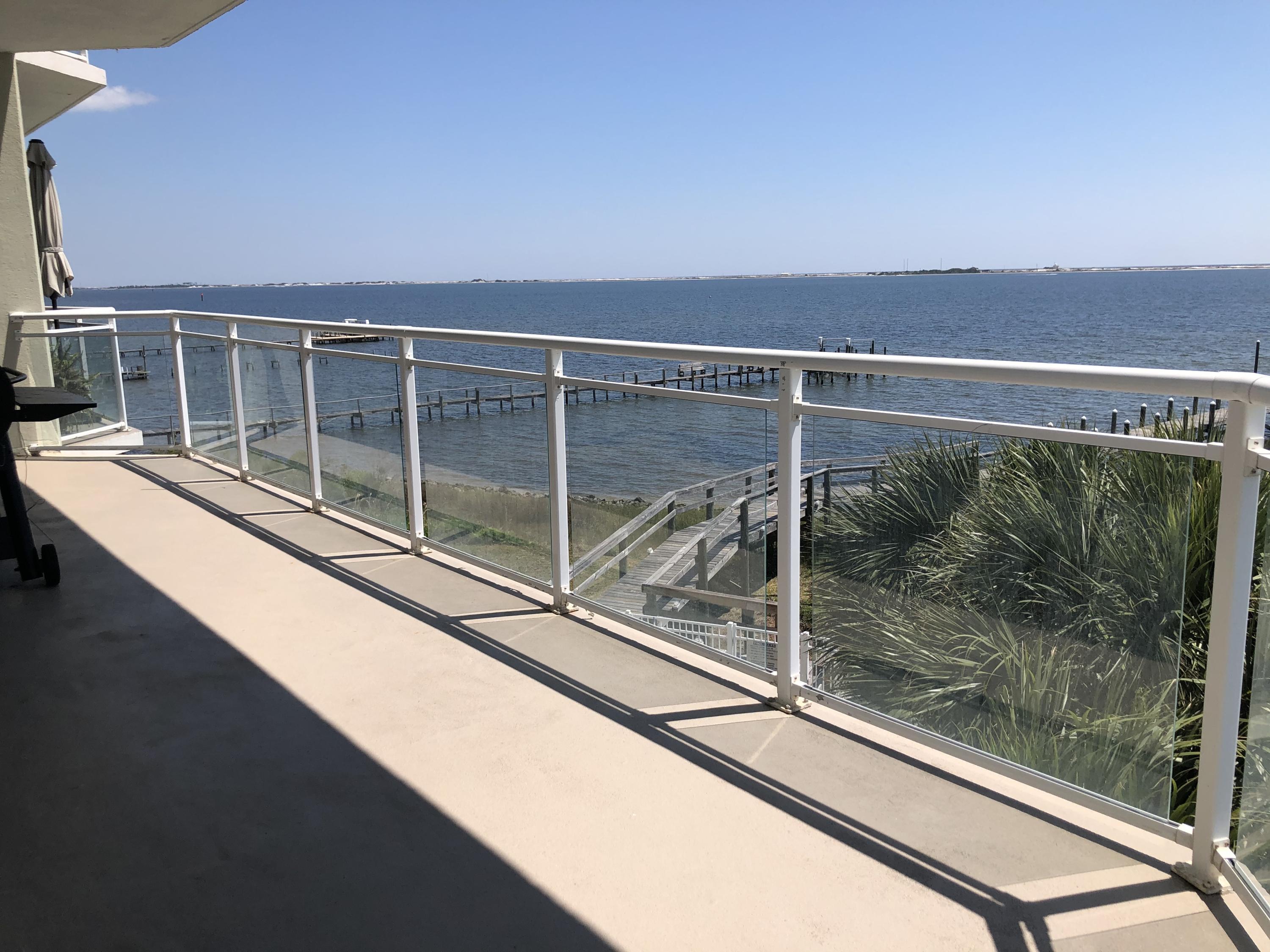 RARE OPPORTUNITY TO OWN A END UNIT IN A PRIVATE, SAFE, QUIET & EXCLUSIVE (23 UNITS) COMMUNITY. GATED & LOCATED JUST NEXT TO NAVARRE BEACH BRIDGE WITH INTRA-COASTAL WATERWAY VIEW, ONE BOAT SLIP INCLUDED IN THIS SALE, 3 LARGE BEDROOMS WITH 3 FULL BATHROOMS (ALL BEDROOMS HAVE PRIVATE ACCESS TO BATHROOMS) 2 MATER SUITES WITH PRIVATE WALK OUT BALCONY AND PRIVATE BATHROOM. HUGE WRAP AROUND PORCH. GRANITE AND STAINLESS APPLIANCES, HUGE LAUNDRY ROOM, HUGE MASTER BATHROOM WITH JACUZZI TUB AND LARGE WALK IN CLOSET. RECESSED LIGHTING, LARGE WALK IN LAUNDRY ROOM, LARGE OWNERS STORAGE CLOSET FOR WATER/BEACH ACCESSORIES. ONE, COVERED PRIVATE PARKING SPACE. HOA INCLUDES MANY UTILITIES. OWNER HAS BEEN RELOCATED TO TEXAS.