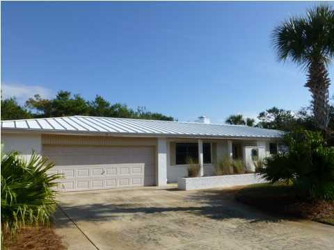 This property is one of the few properties on Mary Street that has its very own deeded beach access. It is only on the market for a short time. It there is not acceptable offer by May a new long term tenant will be put into place. This perfectly renovated, ranch style home is located on a large lot south of Scenic Hwy 30A providing a quiet and private location with low HOA fees. The spacious family living room has built-in book shelves, a cozy wood burning fireplace, an adjacent dining room and galley kitchen with breakfast bar. Special interior features include, 3 nice sized bedrooms, ample closet space, 2 full bathrooms, sunroom, laundry/ mud room and a spacious 2 car garage with storage room. This well maintained all brick home boasts a standing seam roof and also has a 2 foot
