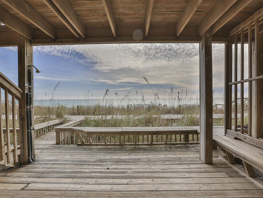 You simply cannot get any closer to the beach than this! The main residence of this fabulous Costa Del Sol Gulf front town home is on the upper second & third floor levels which encompasses the living area, dining room, kitchen & half bath on the second and two other bedrooms and two baths on the third floor. The Master Bedroom Suite has its own private bath and access to an open beachfront balcony where you can catch the beauty of a spectacular sunset or an awesome full moon rise over the gulf. The ''In Law'' space is on the first level and is accessible from above by an outside staircase on the Gulf side. This private space has its own living room which is colorfully decorated in reds and greens. There is a complete bedroom here with a queen sized bed and full bath. Bunk Beds are also