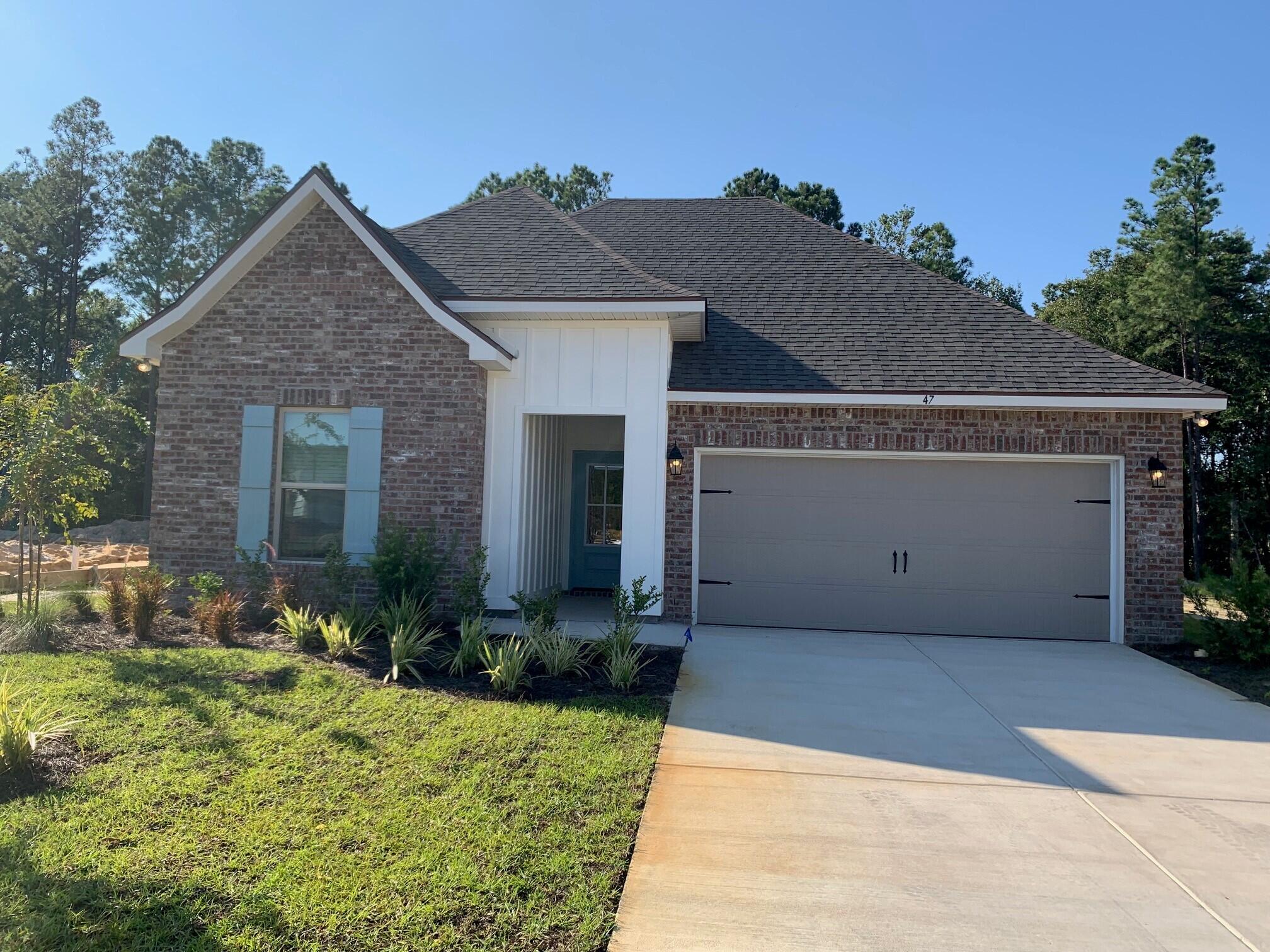 The TRILLIUM III G in Moonswept at Hammock Bay community offers a 3 bedroom, 2 full bathroom, open design. Upgrades added (list attached). Features: double vanity, garden tub, separate custom tiled shower with frameless door, and walk-in closet in the master suite, walk-in master closet continues to the laundry room for added convenience, covered patio, recessed lighting, undermount sinks, framed mirrors, smoke/carbon monoxide detectors, landscaping package, architectural 30-year shingles, flood lights, and more!Energy Efficient Features: water heater, kitchen appliance package, vinyl low E windows, and more!