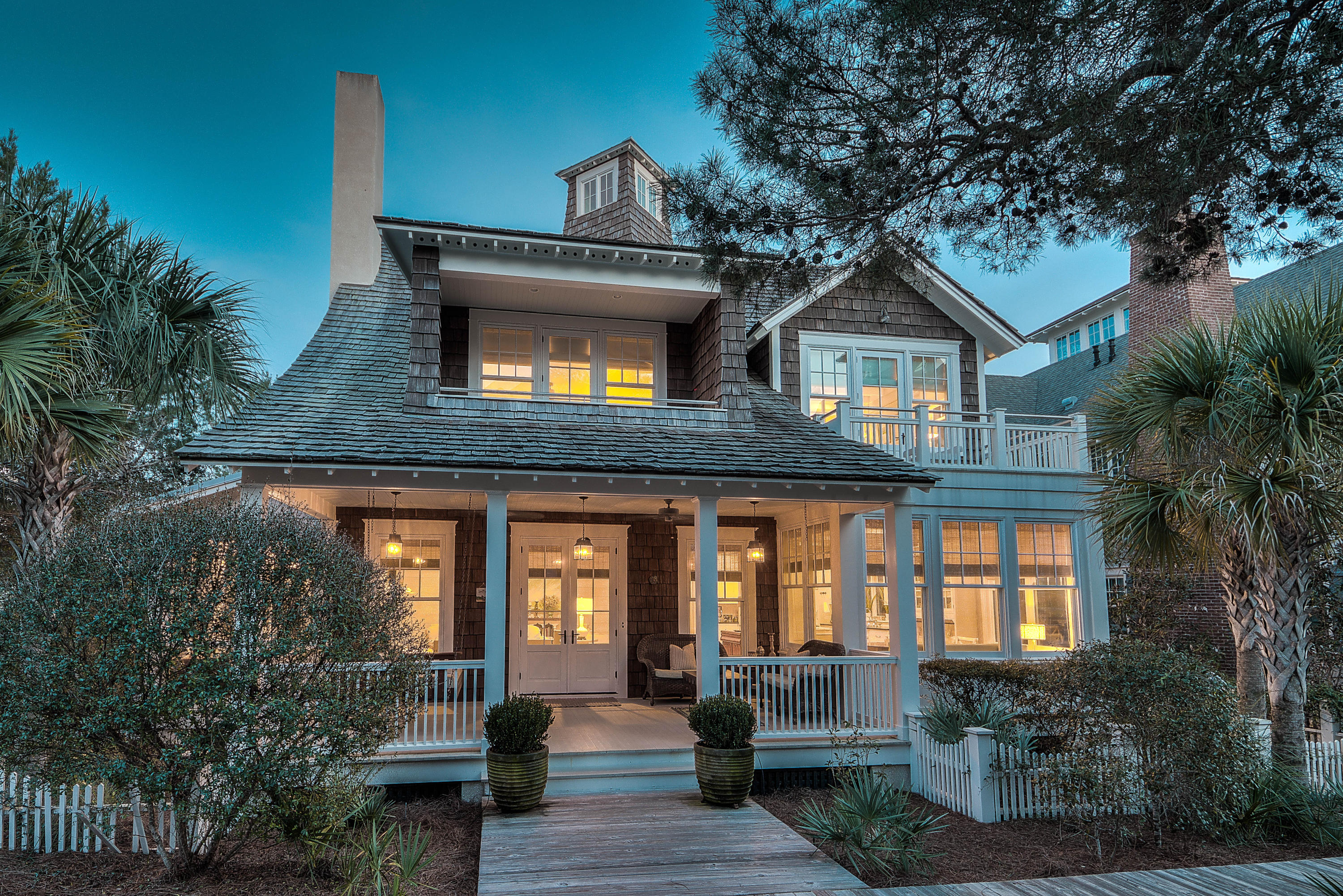 You will understand the treasure chest of wonderful beach living that this home has to offer as soon as you walk through the front door. The understated elegance is felt as soon as you enter and extends about the entire home. The inviting, main level draws you into this pristine residence with large, open, bright spaces. Enjoy grand scale entertaining in the large great room with with a fireplace and walls of elegant windows & doors, opening to the boardwalk, allowing abundant natural light and gulf breezes to flow easily throughout. This beach estate takes you to a by-gone era with the smell of salt in the air, the feel of sand in your toes and the feel of a simpler, magical time. All of this is complemented by the full array of amazing, modern amenities found throughout Watersound Beach