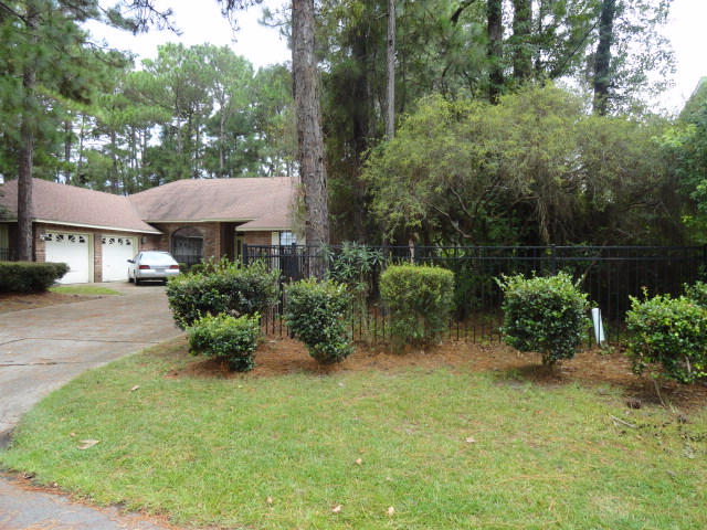 PRICE REDUCTION!!This custom built all brick home is directly across the street from the bay in a very special area. It has a split floor plan with 3 bedrooms on the West side and the Master on the East side. This home features an over sized double garage offering extra storage. It actually has room for third car or golf cart. There is a fireplace in Master bedroom. Outside the large yard features natural landscaping with black iron fencing. Additional room off entry hall is being used as library but could be formal dining room. Legion Park is only a block away with boat ramp, playground, restrooms, picnic area, etc. Washer and Dryer do not convey. Seller to offer Home Warranty up to $450.00 Buyers to verify all dimensions etc. that are of importance to them.Property to be sold ''As Is