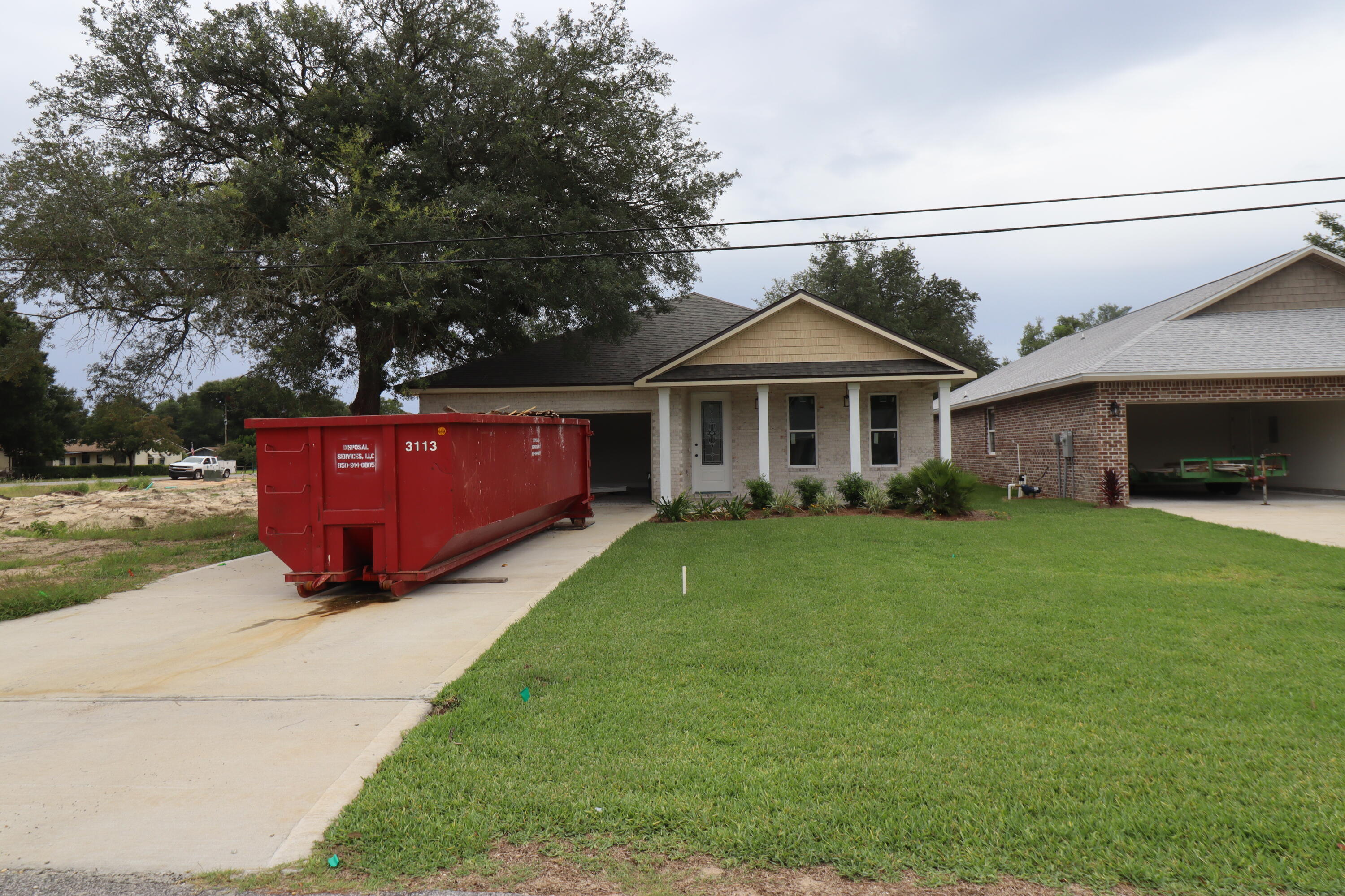 Awesome new plan! This 4/3 custom brick home has super curb appeal and is constructed on a deep lot with both large front and rear yards. There are 10 Ft. Ceilings w/ impressive crown molding, has LVP flooring throughout most of the home except for the wet areas which are tiled. At the right of the dining room is the gourmet kitchen which boasts grey cabinetry, granite countertops, a breakfast bar and stainless appliances. Bedrooms 1 and 2 are located near the front entry along with bathrooms 1 and 2. The large master suite is located at the rear of the home and has a double vanity, 2 large walk -in closets, whirlpool tub and separate shower. Yard is fully sodded/ landscaped and comes complete with a well and sprinkler system. Completion expected in mid March 2023.