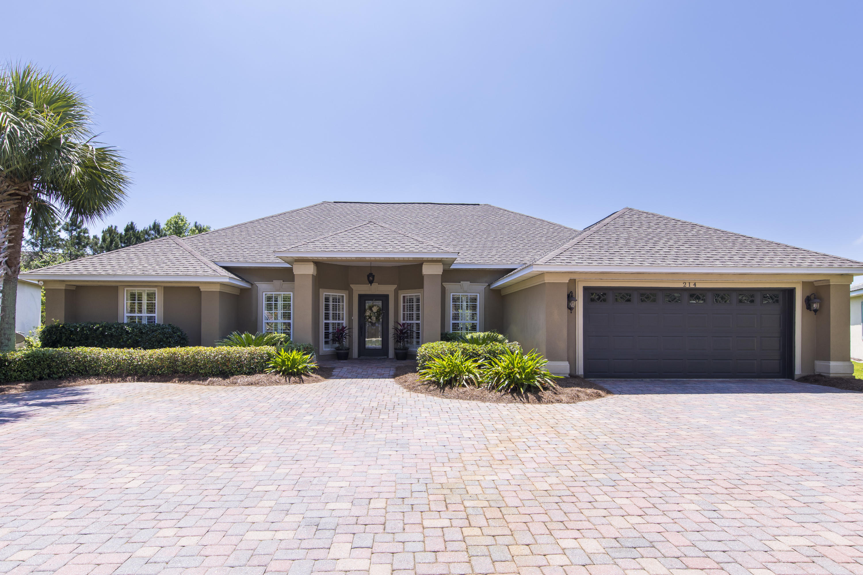 Don't miss out on your chance to own a beautiful home in Destin's Emerald Lakes neighborhood! This gorgeous one-story home offers quality craftsmanship and high-end upgrades throughout. Plantation shutters can be found throughout the home, accompanied by raised ceilings with a knock-down finish. The eat-in kitchen overlooks the lake, complete with granite countertops and stainless steel appliances. Additional rooms consist of a formal dining room, great room, and office space. In the master suite, take in the tray ceiling, lake views, large walk-in closet, and private bathroom with a whirlpool tub and separate shower. Exterior features include a covered front porch, two-car garage, outdoor shower, and doggie door right off the porch. You'll also have access to Emerald Lakes' amenities,