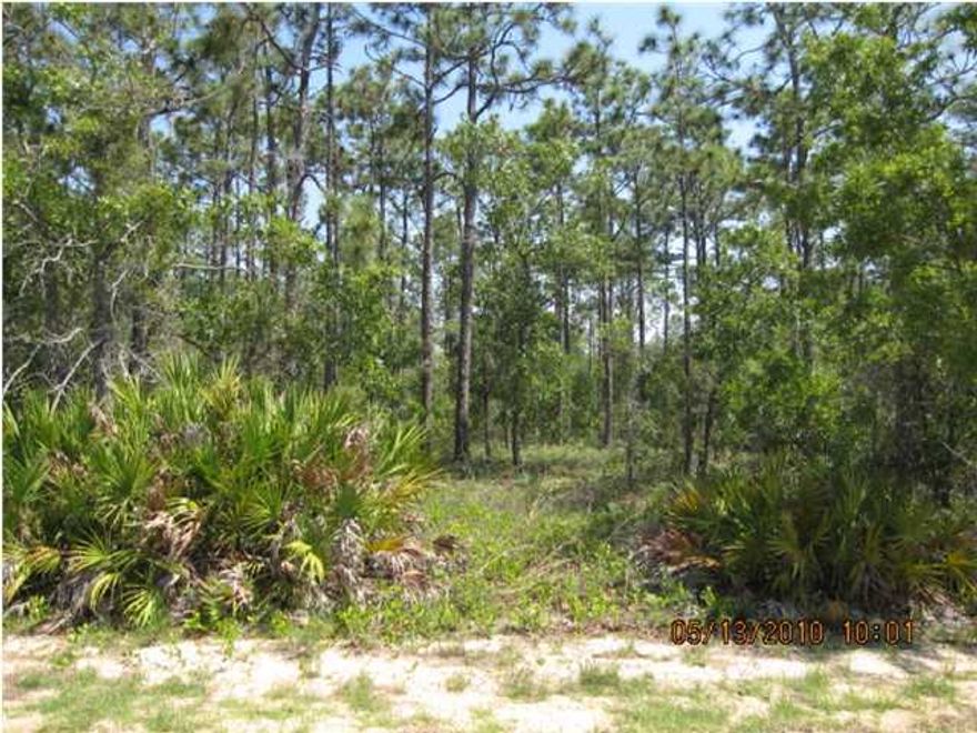 Great LOCATION, for building your new home. Just one lot from the entrance of the new subdivision. Close to the high school, beaches and shopping. This large parcel of 1.12 acre offers a country setting. No covenants/restrictions, Zone SFR RIM*. NO ASSOCIATION DUES! Build your home, workshop, horse-friendly, paved road. Close to Hurlburt.