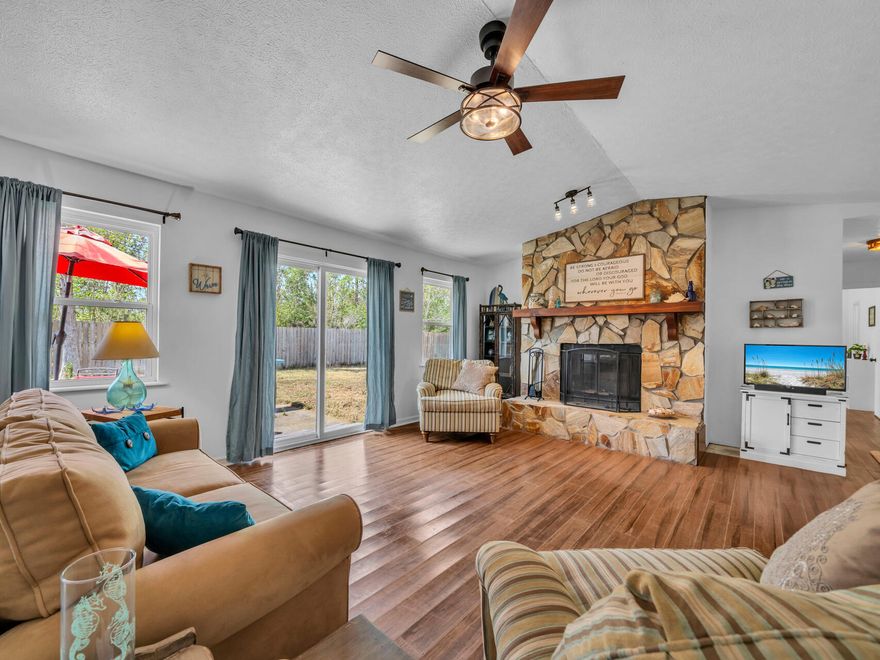 Enjoy the calm of country-style living in the Sandy Creek area. This 3 bedroom, 2 bath home features a cozy fireplace, 2 car garage, fenced backyard with an outdoor storage shed.Home is sold AS-IS. All measurements are approximate and should be verified if important.