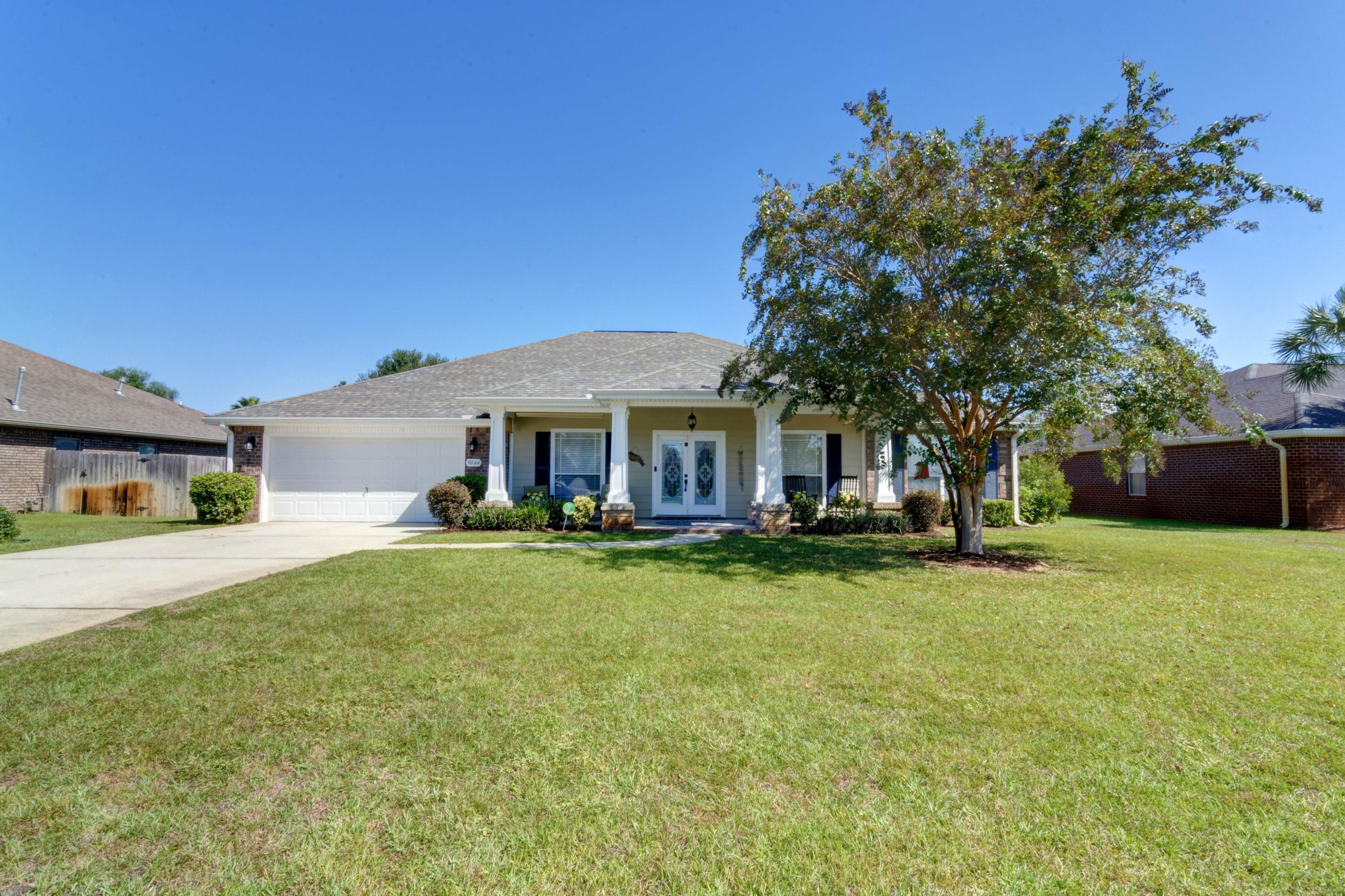 Your spacious dream home has arrived! This stunning 4 bedroom/3 bath (plus two flex rooms!) Craftsman style beauty is located in the Meadows featuring all Whitworth Builders homes in an east Navarre neighborhood with underground utilities conveniently located a short drive to Hurlburt AFB and only minutes to Navarre Beach's emerald green water and white sugar sand! The covered front porch invites you to the beautiful, leaded-glass front door and tiled front entryway where you'll find the two flex rooms on either side. Double french doors open to their current playroom, and on the other side you'll find the office with gorgeous hardwood flooring which spans into the expansive living room. Your jaw will drop when you see the massive gourmet kitchen with plenty of custom cabinetry and granite