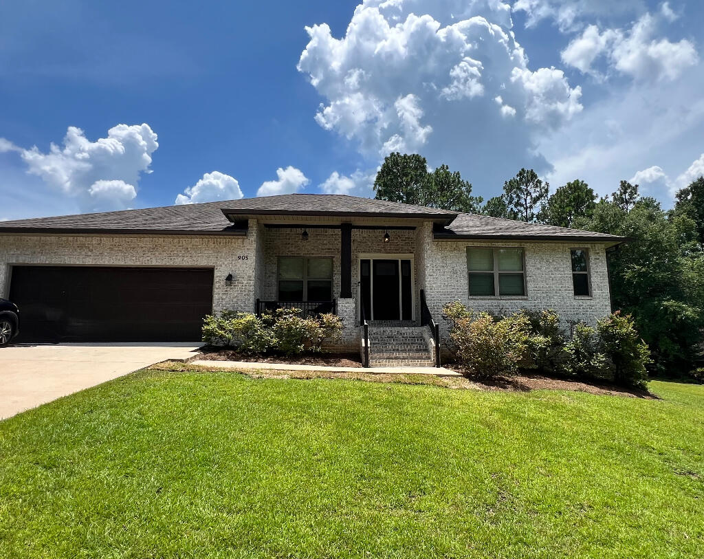 Gorgeous 4-bedroom 3-bath home, 2-car garage on a 1/3 acre lot. Coffered ceiling in living room, electric fireplace, hard wired surround sound (also on porch), board & batten wainscoting in common areas, split floor plan featuring a Jack & Jill bathroom. Kitchen features granite countertops, double wall oven, wine fridge, built-in electric cooktop top, large stainless steel drop-in sink, tray ceilings, eat-in breakfast nook, walk-in pantry as well as a walk-in utility room off the kitchen. Soft close cabinet doors/drawers. Vinyl plank flooring throughout with ceramic tile in bathrooms. Huge master bedroom closet with custom shelving. Walk-in master shower, separate jacuzzi tub, double vanity and an additional vanity sitting area. Large walk-In closets in other rooms.Irrigation system.