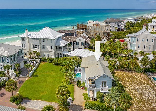 South of 30A in a charming, gated neighborhood in the heart of Seagrove awaits your ''Some Day'' beach home. This enchanting beach haven boasts gulf views from 2nd level living space and bedroom. On the first level of the home, you will find a master bedroom w/ spacious ensuite bathroom complete with a soaking tub and walk in shower. A master guest room with ensuite bath and a 3rd guest room with bunks complete the interior lower level. As you ascend to the upper level you will be swept away with the spacious living room adorned with a custom oak fireplace. Open the deck door from the living space and dream of watching the sun go down while enjoying your favorite beverage.
