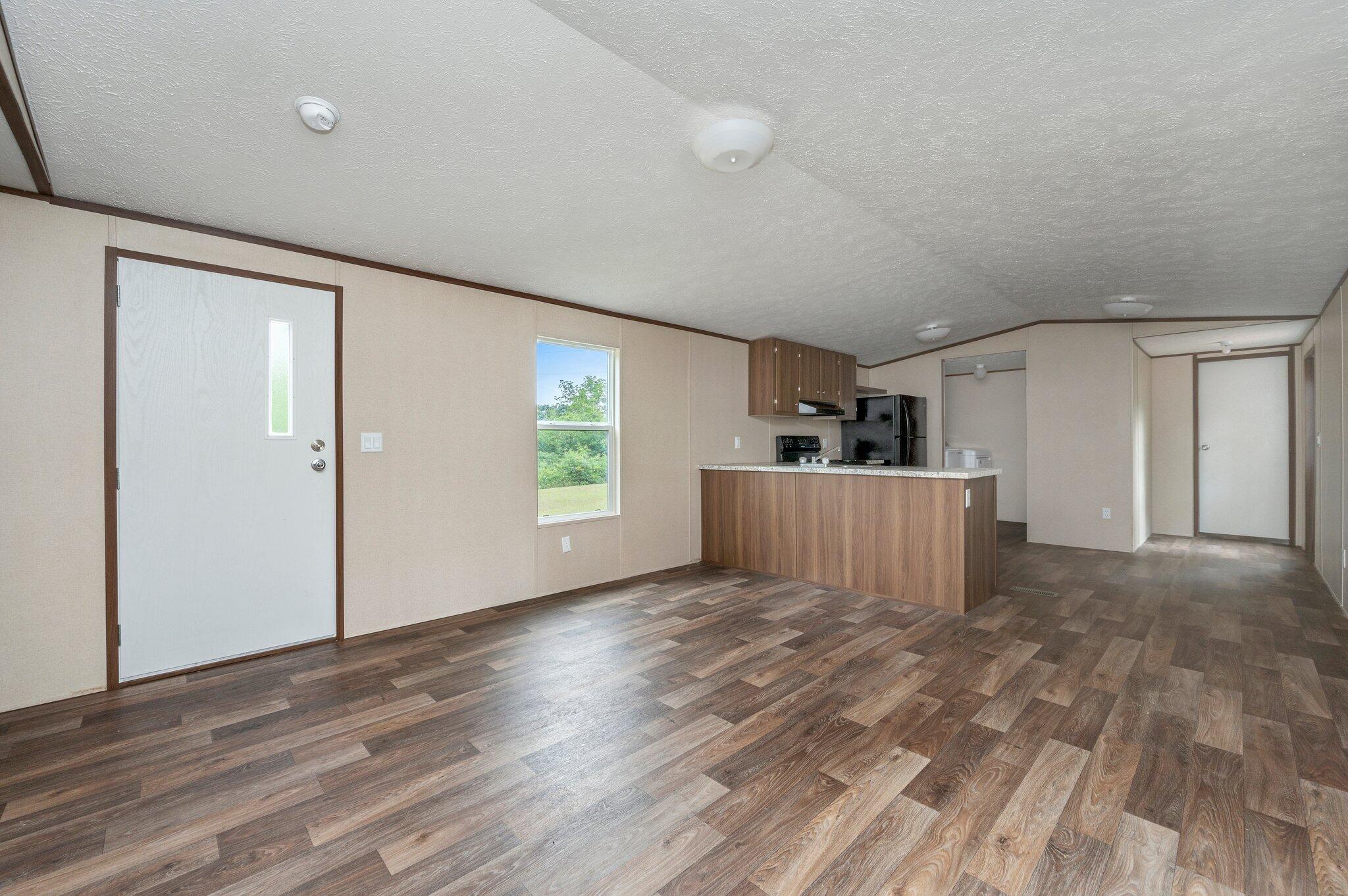 MOVE-IN READY! Nearly new 2 bd/2 ba mobile home situated on a one acre lot in Baker. Neutral tones throughout with wall color and vinyl flooring. Open floor plan! Kitchen boasts breakfast bar and is complete with refrigerator, dishwasher and stove/oven. Nice sized rooms. Buyer to verify all areas of importance.