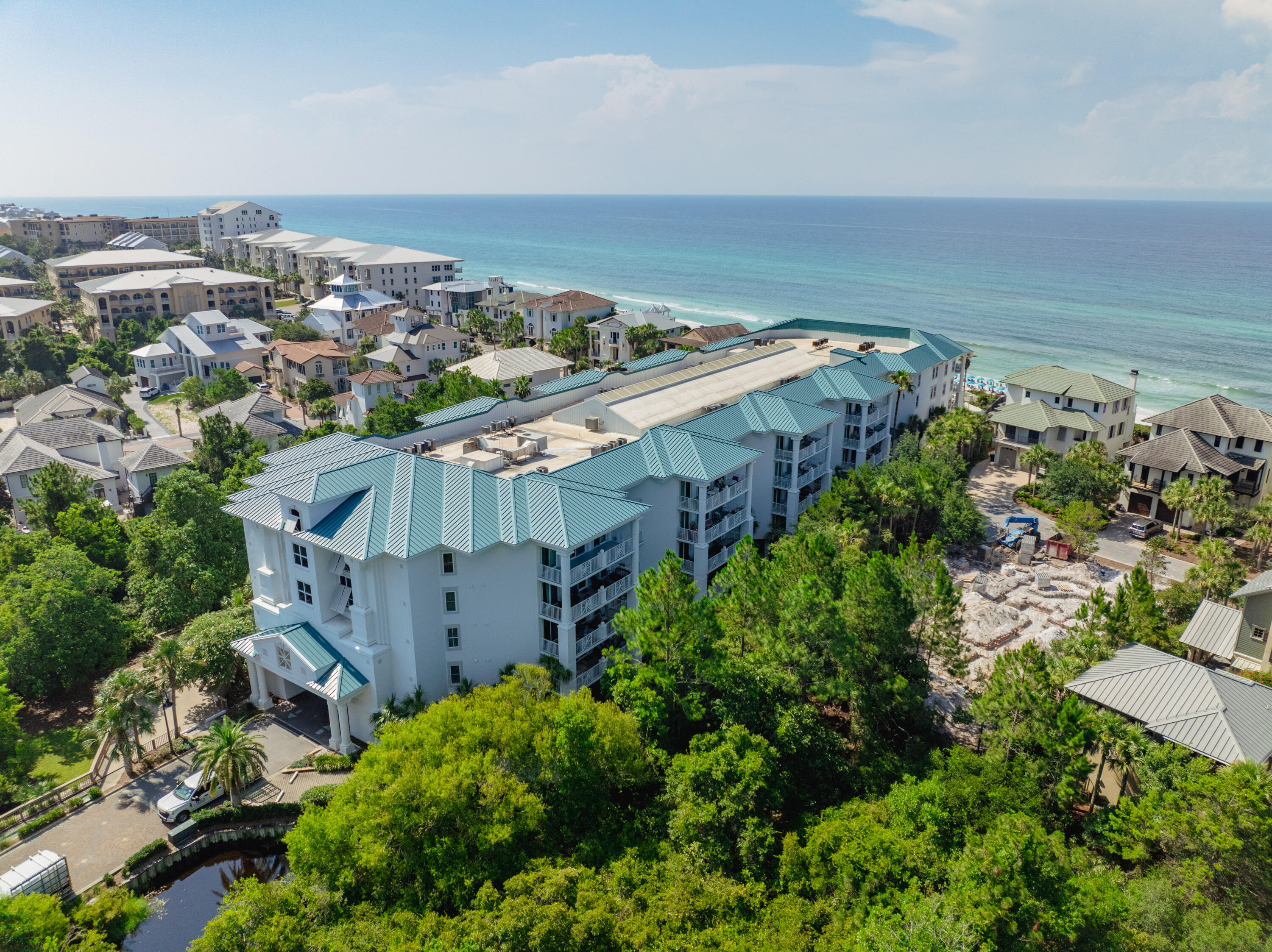 Blue Mountain Beach condo has Private Beach w/Gated Access & seasonal beach services! A hidden gem for those seeking solace in the shimmering waters of the gulf. Inside you'll be greeted with modern elegance. The kitchen is adorned with granite, S/S appliances and pendant lights. Attractive new light-colored wood plank floors throughout; recently painted; new furnishings. Furnishings do convey! Inviting spacious balcony. Split floorplan- master en-suite enjoys personal balcony; Stacked washer/dryer hall closet. New Sliding Doors/Windows installed. Dec 2024. Water heater replaced in 2017. Covered parking & elevator. Fitness center onsite. Pool and hot tub offer a retreat overlooking the beach. On rental program. Resort living with entertainment, dining, and shopping options~