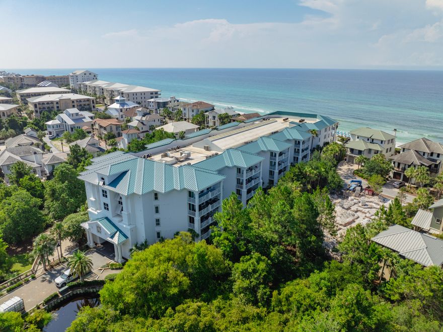 Blue Mountain Beach condo has Private Beach w/Gated Access & seasonal beach services! A hidden gem for those seeking solace in the shimmering waters of the gulf.  Inside you'll be greeted with modern elegance. The kitchen is adorned with granite, S/S appliances and pendant lights. Attractive new light-colored wood plank floors throughout; recently painted; new furnishings. Furnishings do convey!  Inviting spacious balcony. Split floorplan- master en-suite enjoys personal balcony; Stacked washer/dryer hall closet. New Sliding Doors/Windows installed. Dec 2024.  Water heater replaced in 2017.  Covered parking & elevator. Fitness center onsite. Pool and hot tub offer a retreat overlooking the beach. On rental program.  Resort living with entertainment, dining, and shopping options~