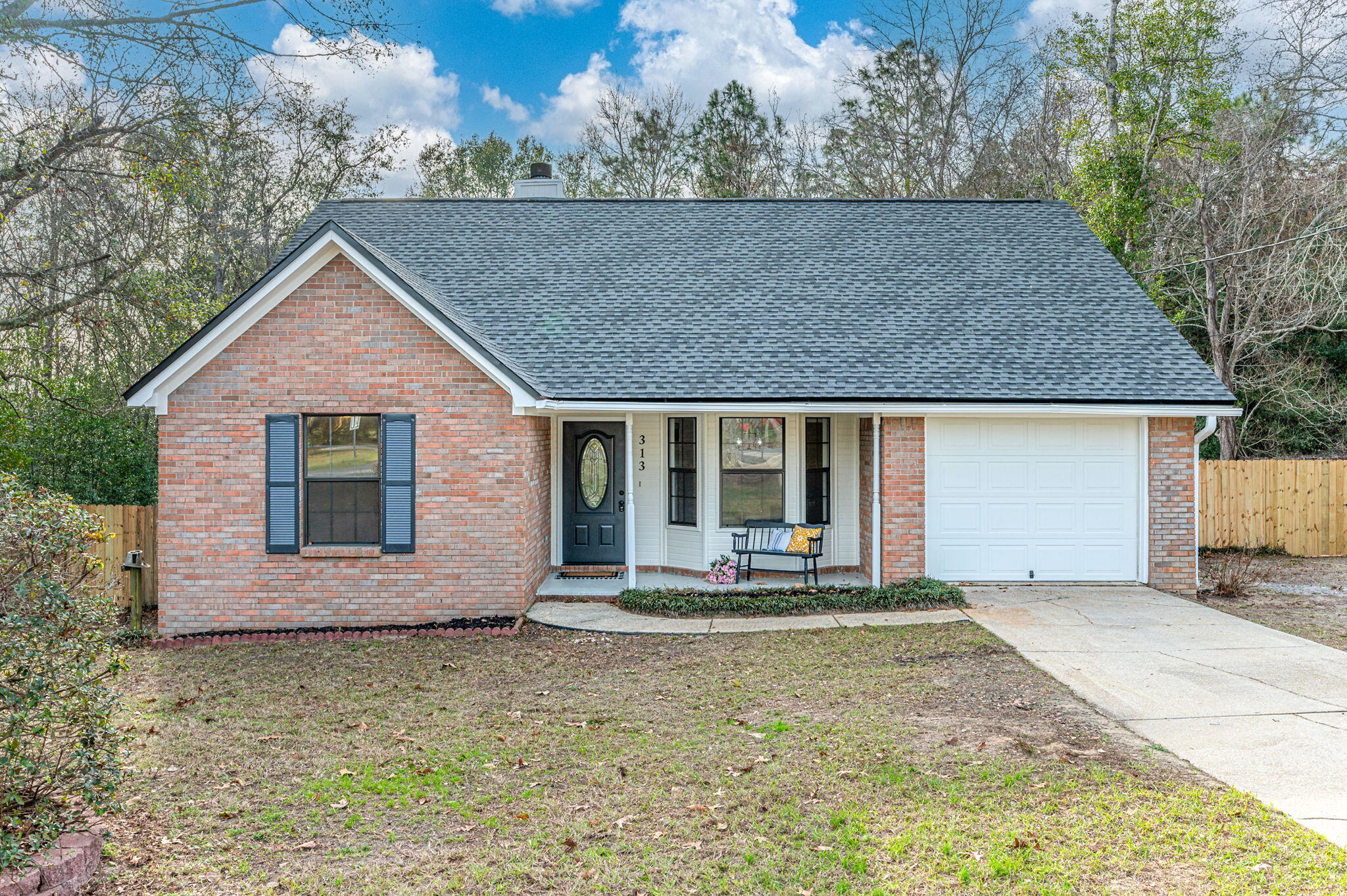 SELLER IS OFFERING TO LOWER YOUR INTEREST RATE! This beautiful home boasts 4 generously sized bedrooms and 2 pristine bathrooms, with a split/open floorplan. New Roof, New Paint, With no carpet throughout, stainless steel Whirlpool appliances, tile flooring and ceiling fans in every room provide year-round comfort. The shiplapped fireplace adds warmth and character. Step out onto the expansive deck overlooking a large, fenced backyard ideal for entertaining or relaxing. A practical shed and single enclosed garage complete the package, offering additional storage. Embrace the perfect balance of style and function in this exceptional home!