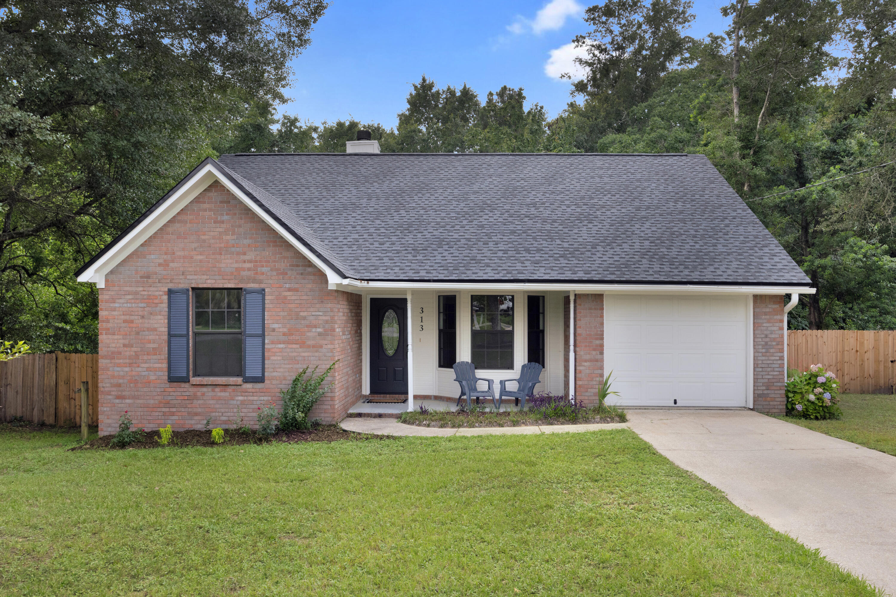SELLER IS OFFERING TO LOWER YOUR INTEREST RATE! This beautiful home boasts 4 generously sized bedrooms and 2 pristine bathrooms, with a split/open floorplan. New Roof, New Paint, With no carpet throughout, stainless steel Whirlpool appliances, tile flooring and ceiling fans in every room provide year-round comfort. The shiplapped fireplace adds warmth and character. Step out onto the expansive deck overlooking a large, fenced backyard ideal for entertaining or relaxing. A practical shed and single enclosed garage complete the package, offering additional storage. Embrace the perfect balance of style and function in this exceptional home!