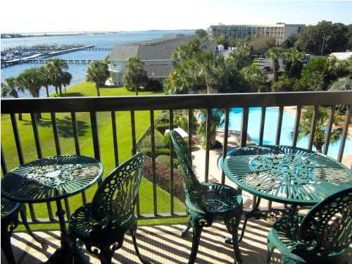 Beautifully updated throughout, 4th Floor WATERFRONT Studio Condo... WITH OWNER FINANCING AVAILABLE - Fourth Floor Units have the greatest Views in the Complex and this particular Unit has really great ''Sunset'' views to enjoy.. It overlooks a huge Pool, the Marina and the fantastic InterCoastal Waterway.. what a great setting, with even views of the Gulf. What a gorgeous setting. This Condo comes with your very own Deeded Right to Use Boat 42ft Boat Slip #B4, which even has a ''Jet Ski Lift'' in place that can possibly be purchased at a reasonable price.. (Owner can remove if not needed by Buyer) This Condo can be your secret get-away, which comes with New a/c and heat unit, new water heater, new microwave, new refrigerator, new no rust fiberglass front entrance door with
