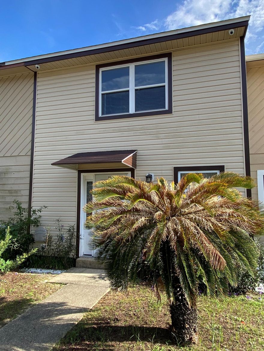 Welcome Home! This cozy townhome is well-maintained and move in ready. This home features tile throughout the first floor and wood laminate on the second floor. Out the back door is a patio and large storage closet.  You will love the potential that the fully fenced backyard offers. Upstairs you will find a spacious master bedroom with walk-in closet, vanity and dressing area, and private entrance to the bathroom.  The second bedroom is good sized and would make a perfect guest bedroom or home office.  Back downstairs you will find the laundry room and half bath. New roof installed in 2021.  NO HOA!  Located in the heart of Fort Walton Beach, this home is just a few blocks from downtown shopping, dining, and entertainment, and just a few minute drive to the beautiful white-sand beaches.