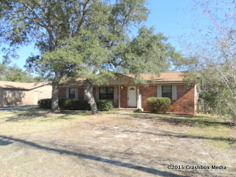 A beach house with privacy in Navarre? Home is THIS close to the Santa Rosa Sound and you have water views from this property. This brick home has a fireplace in the living room, large eat-in kitchen, and a sunroom. This quaint home is convenient to the beach, military base, shopping, and restaurants. It is sold as is. All information is approximate and should be verified.
