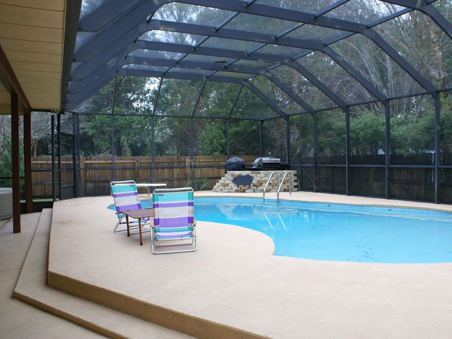 View of Choctawhatchee Bay from the large front porch. One third acre on a beautifully landscaped lot. An awesome backyard with a 14'x32'enclosed pool with diving board and decking, perfect for those family BBQ'S.There is also a storage shed for the lawn equipment. The lot is huge with plenty of room for a growing family. The floor plan consists of 4 bedrooms and 3 full baths plus,there is also a separate Florida room. All heated and cooled living space. It has a side loading garage that you don't see from the street. The floors consist of 20'' diagonal tile, some carpeting and wood flooring. There is one remote bedroom with full bath, perfect for a teenager or an in-laws quarters. Raintree Estates has a 2 acre beach park.