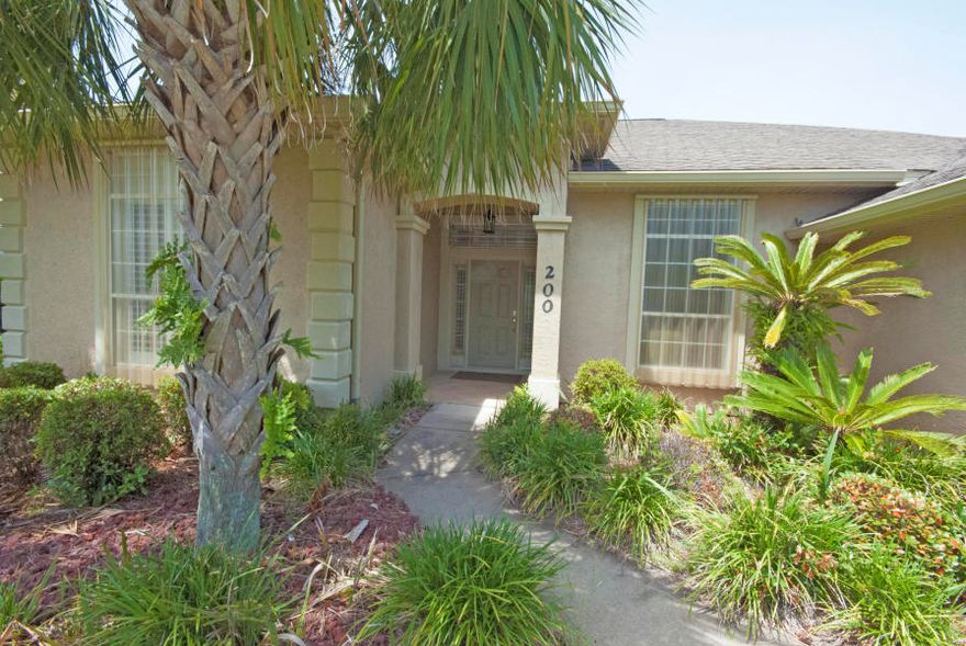 This gorgeous 3BR 2Ba home is located on a corner lot with an enclosed inground heated pool. This home features a large living area with corner fireplace, split bedroom plan, tile floors, 10 ft ceiling, and a formal dining area. Kitchen features a serving bar with granite countertops, upgraded appliances, and a breakfast nook that overlooks the pool. Master suite has an adjoining bonus room with french doors. Master bath features separate shower and jacuzzi tub. Located on the west end of the beach in the highly sought after golf cart friend subdivision of Summer Breeze you are within walking distance to the beach, convenience to Pier Park, restaurants, & entertainmen