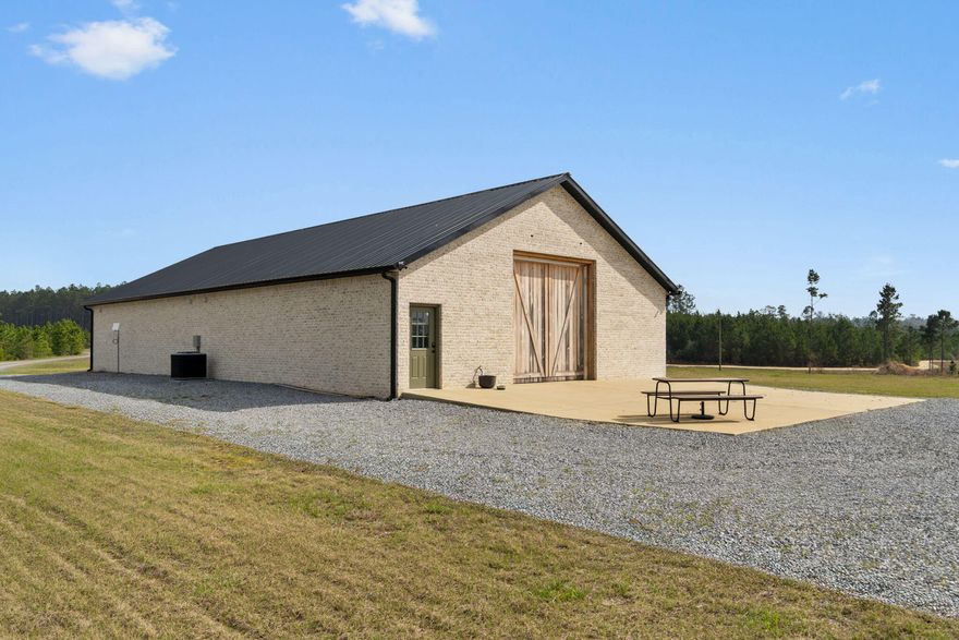 Set on 81 acres of beautifully cleared countryside, the barndominium at 1133 Show Horse Way in Laurel Hill, Florida offers a rare blend of privacy, space, and authentic rural charm. Surrounded by the rolling beauty of Walton County's scenic landscape, this property feels like a retreat from the everyday--open skies, peaceful pastures, and long views that stretch for acres. Whether you envision horses grazing, weekend gatherings, or simply room to breathe, the land provides endless possibilities while still capturing the simplicity and serenity that makes North Florida so desirable.A picturesque creek with a white-sand bottom winds its way out of sight, at the end of Show Horse Way, adding a natural focal point that feels straight out of old Florida. Complementing the home is a separate pole barn, thoughtfully set away from the residence, providing ideal space for tractor and equipment storage while keeping the living area quiet and uncluttered.
Seller has never occupied the property and has no disclosures or knowledge of its past or current condition. Seller is making no claims or warranties of such property. It is the sole responsibility of the buyer to inspect the property to determine its condition. Both the Seller and the Buyer agree to hold harmless the listing and selling agents and their respective brokerages from liability regarding the property condition.