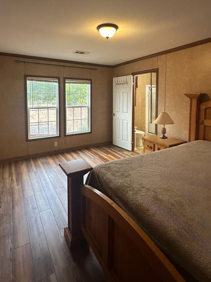 Motivated Seller!Discover this incredible 0.51-acre property, conveniently located just miles from I-10, Mossy Head, Crestview, and DeFuniak Springs. This charming 3-bedroom, 2-bathroom home features an open-concept layout, offering plenty of space for cooking, entertaining, and everyday living. Enjoy the peaceful surroundings from the spacious front and back wooden decks, both providing beautiful views of the serene countryside. Love outdoor adventures? Just minutes away, Morrison and Vortex Springs offer incredible opportunities for fishing, snorkeling, scuba diving, and paddleboarding. Experience crystal-clear waters and endless fun right in your backyard!