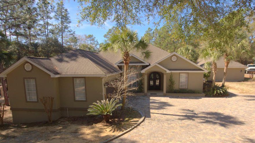 A beautiful, custom home with all the extras and 3.6 acres in a prime location ! In ground, Gunite heated pool, guest Apartment, pool house, Detached Office workshop, wildlife, paved road and much more. Starting with the inside, you will find extreme upgrades and custom touches throughout.The kitchen is open Living' top of the line appliances include a Gas, Wolf oven and range, sub-zero refrig., ice maker, 4x8 Granite kitchen island, 12 foot ceilings, a walk-in pantry, 4 large bedrooms in a split bedroom floor plan and an amazing master Bathroom that is a ''one of a kind'' The master bedroom has it's own private, covered deck that overlooks nature and there is a large sitting room off of the master as well. The main living area is massive and is great for entertaining large crowds.